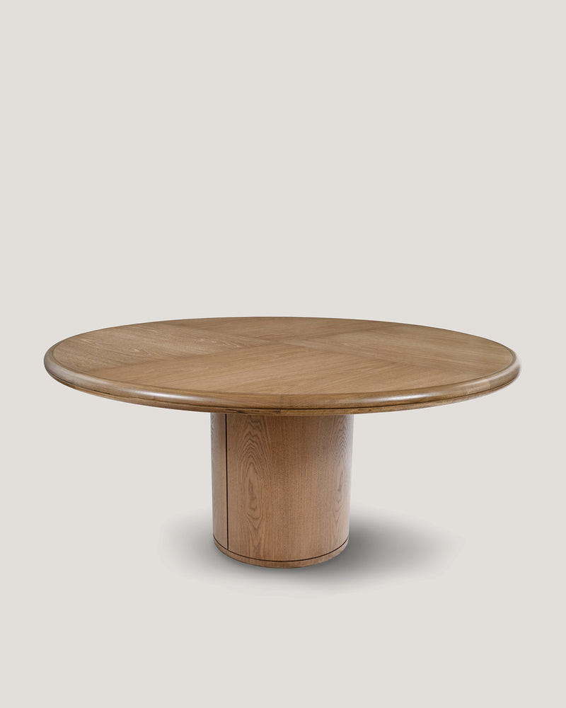 Moon round dining table in natural oak with cylindrical pedestal base