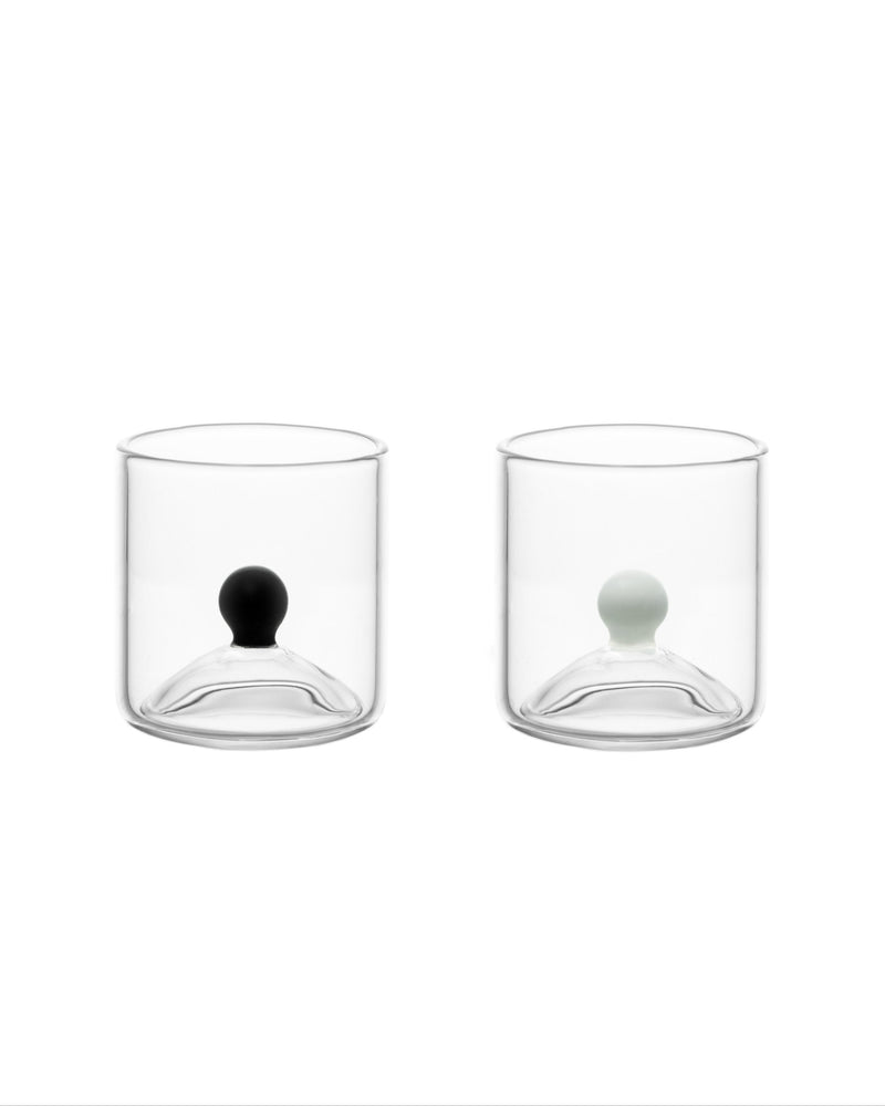 Set of two clear glass shot glasses with black and white sphere details