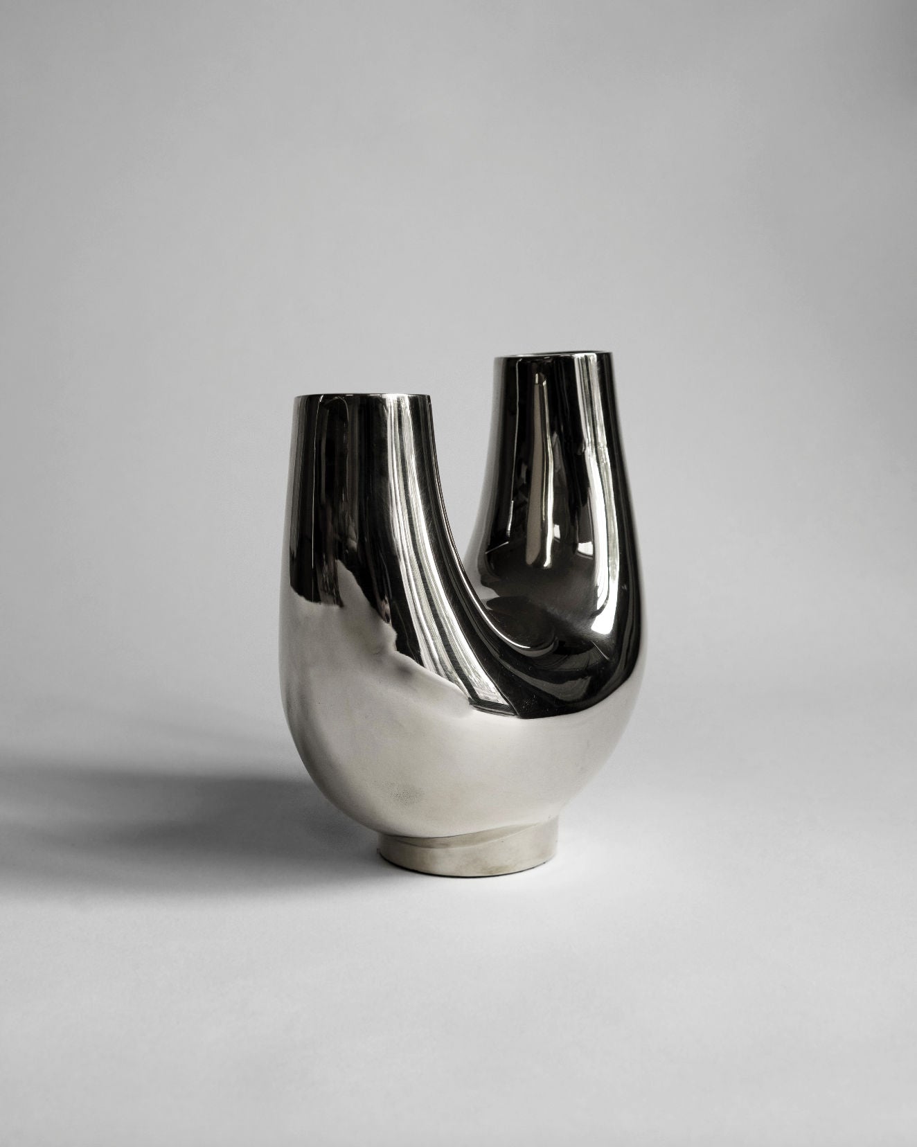 Kazumi Vase - Titanium — angled view on gray backdrop