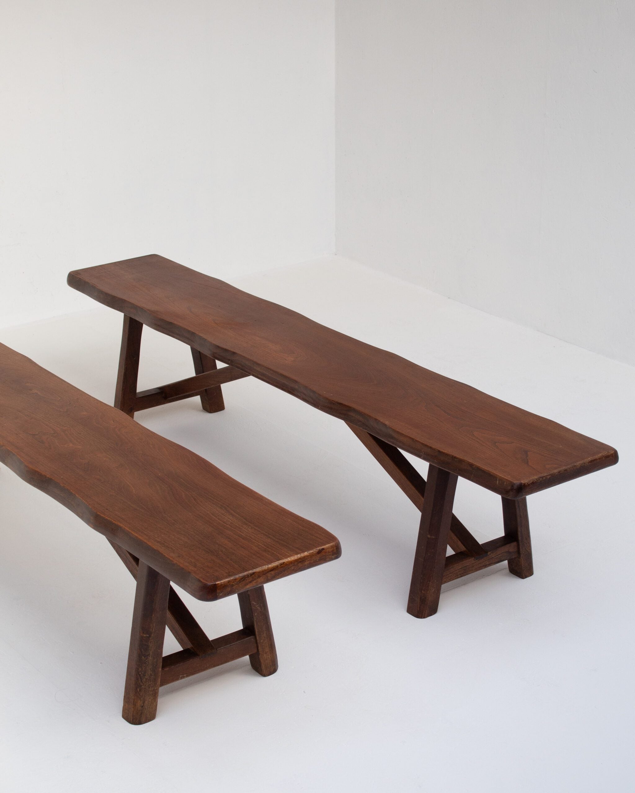 Rustique Bench in Wood — side angle showing rich brown wood grain