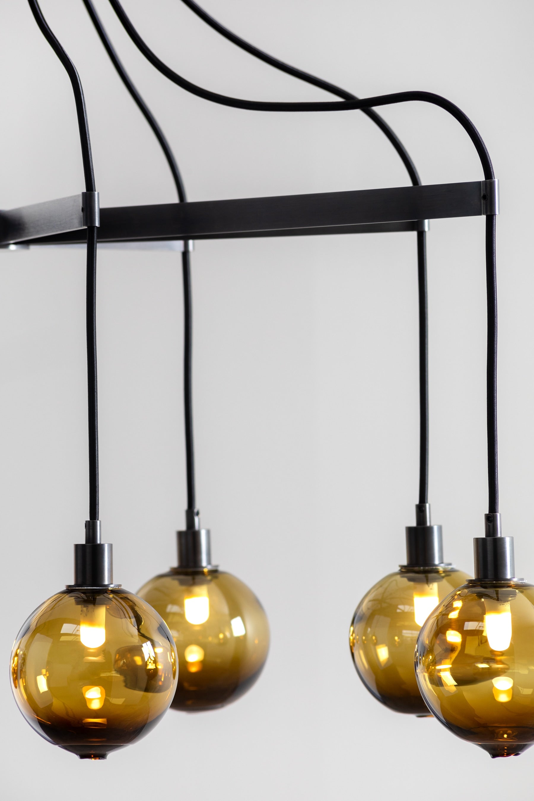 SkLO Drape Arm 8 Chandelier - Olivin glass, Dark Oxidized finish — detail view