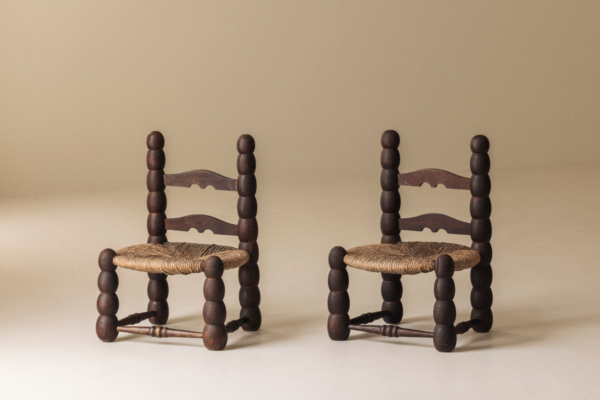 Pair of Spanish Bobbin-Turned Side Chairs with Rush Seats, Early 20th Century by Modern Living | The Oblist