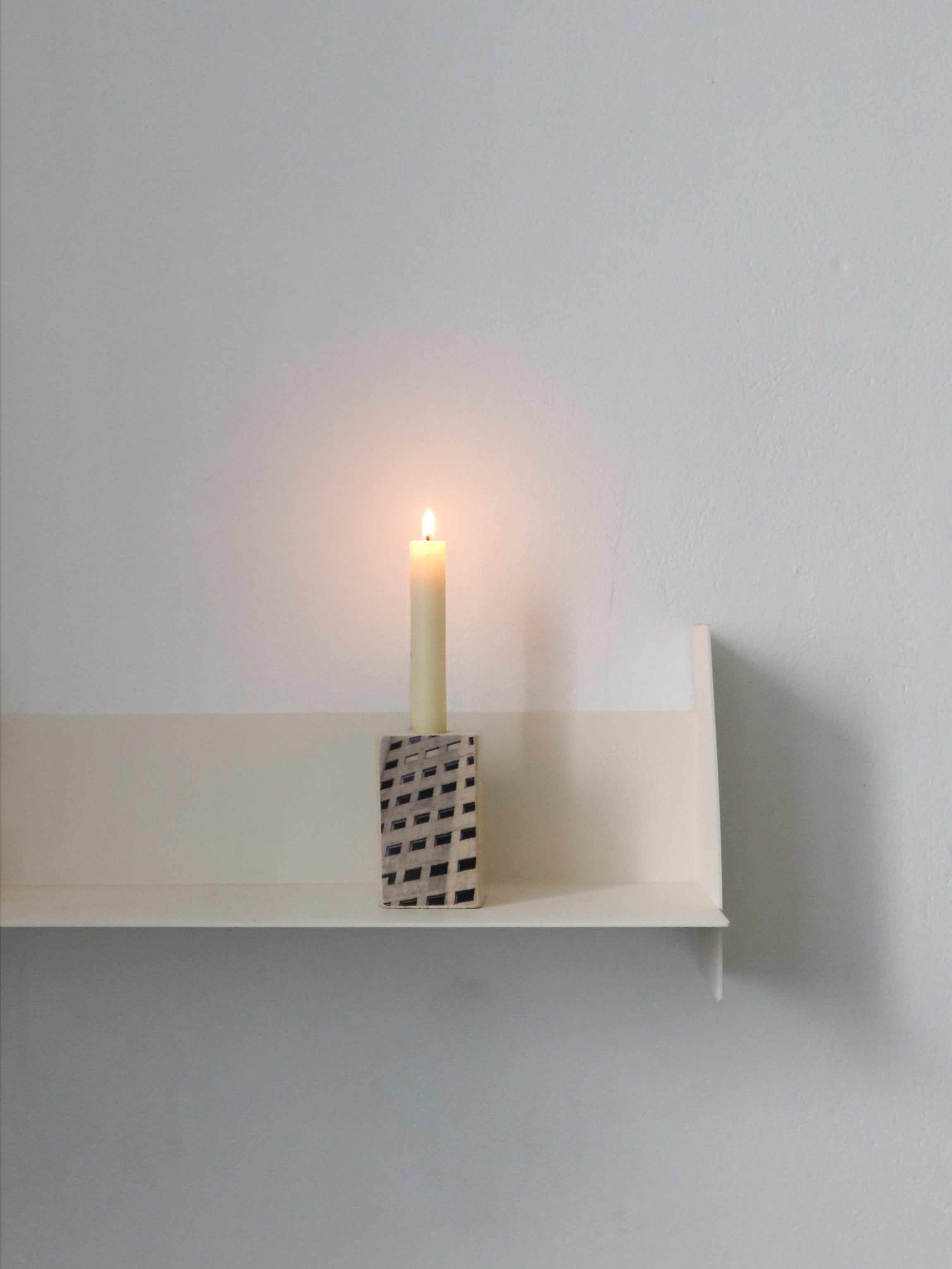 Photographic candle holders - building — close-up
