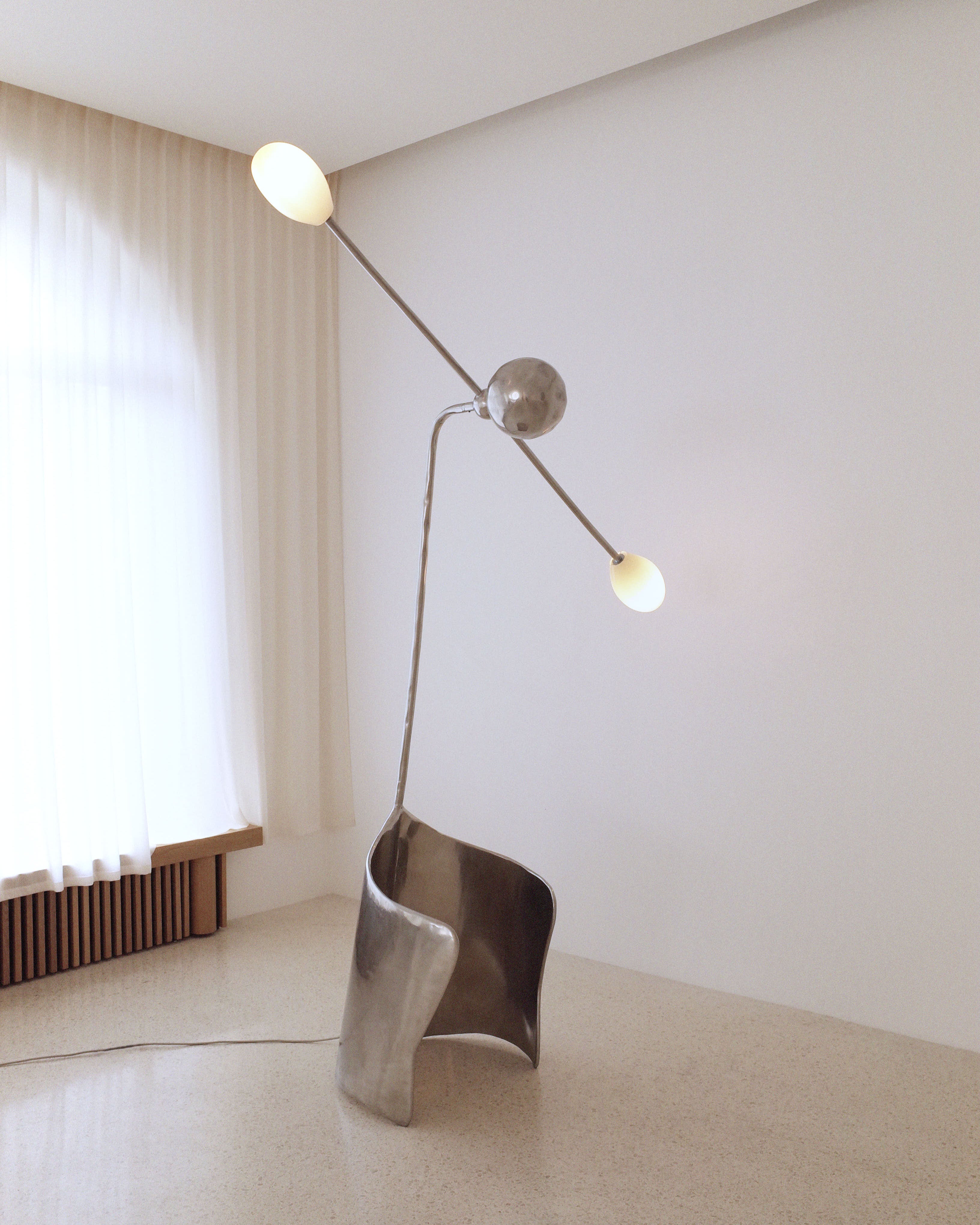 The MOULIN Floor Lamp in Polished Stainless Steel