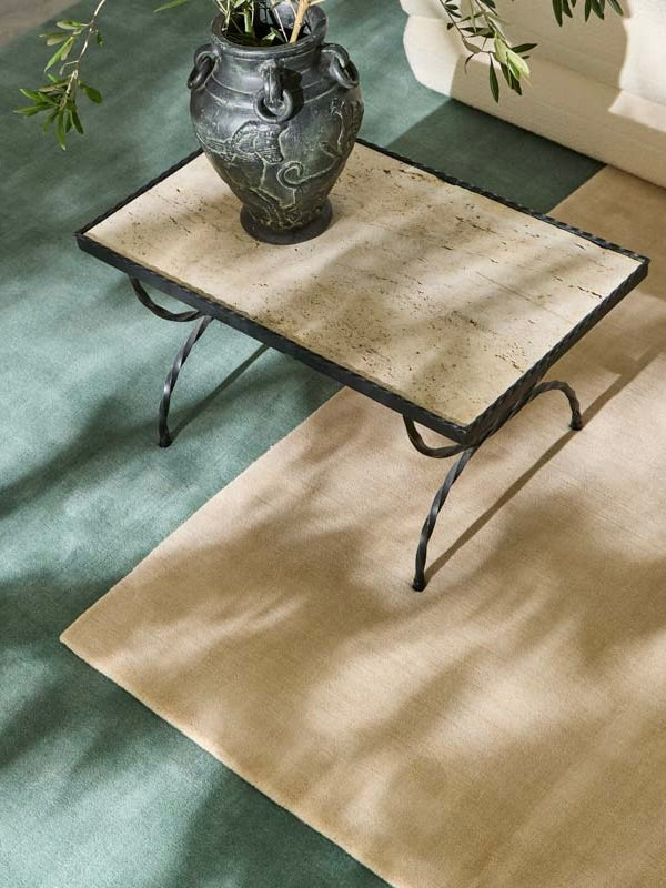 Hand-woven Rug in New Zealand Wool. Pale Blue — close-up on rug under coffee table