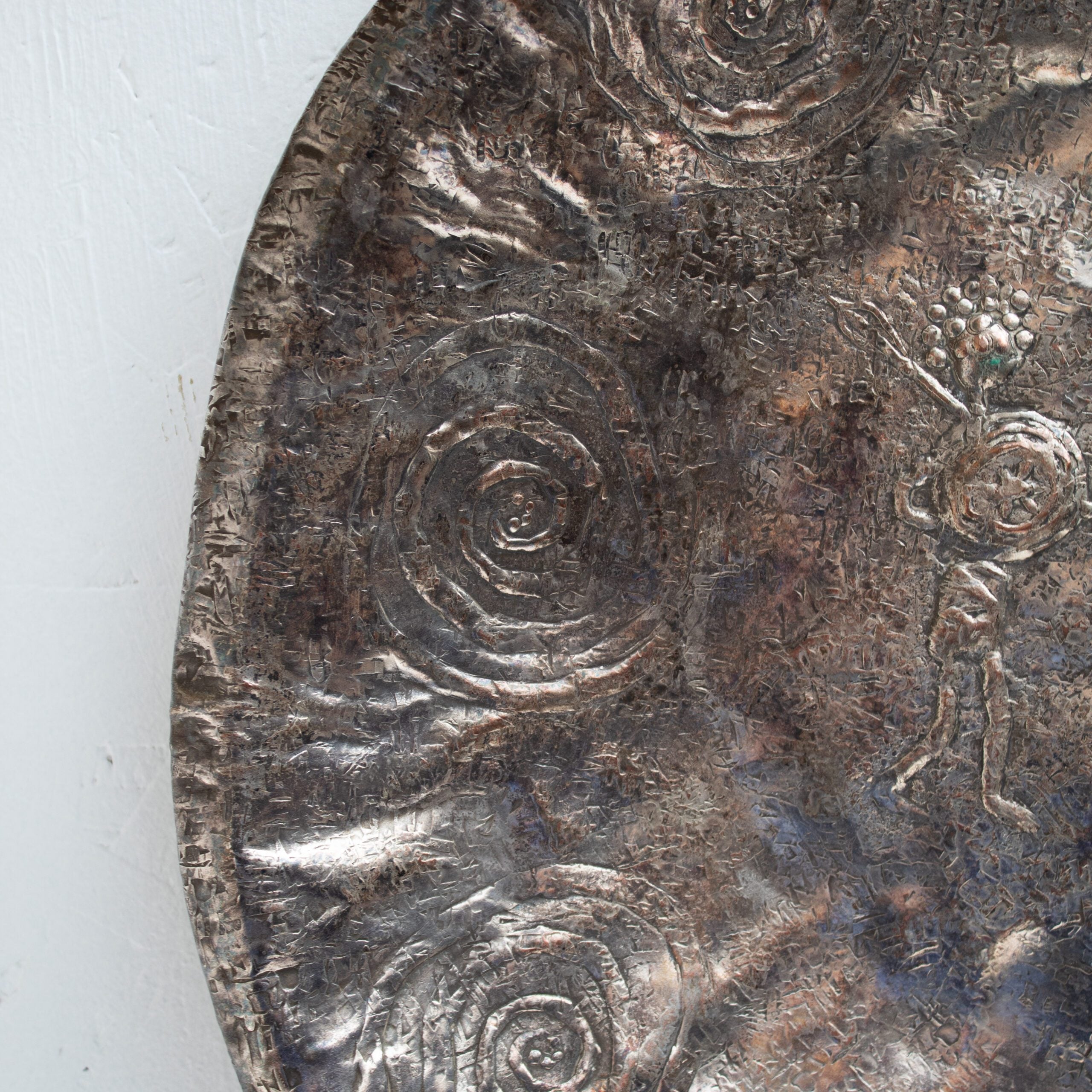 Bragalini Wall Art with Spiral Relief Motif in Hammered Metal — lifestyle setting