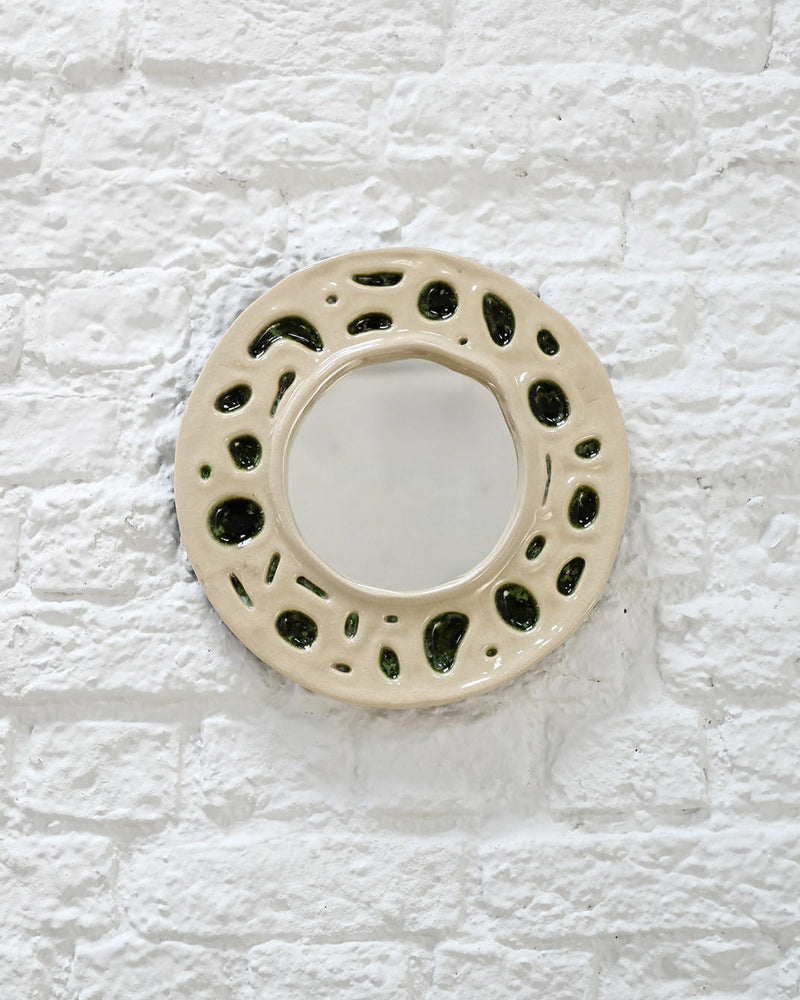 1950s cream ceramic mirror with moss green organic cutout pattern
