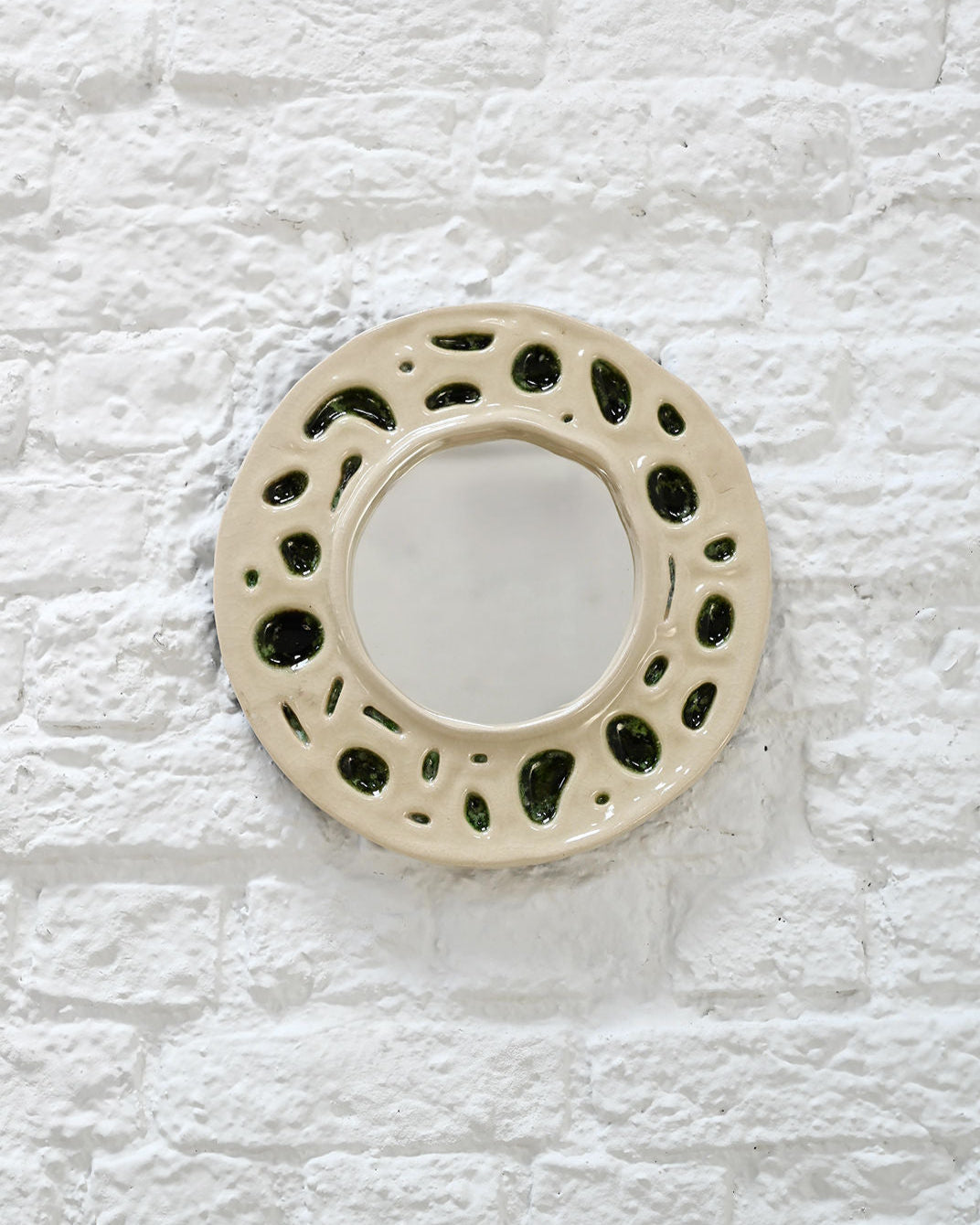 1950s cream ceramic mirror with moss green organic cutout pattern