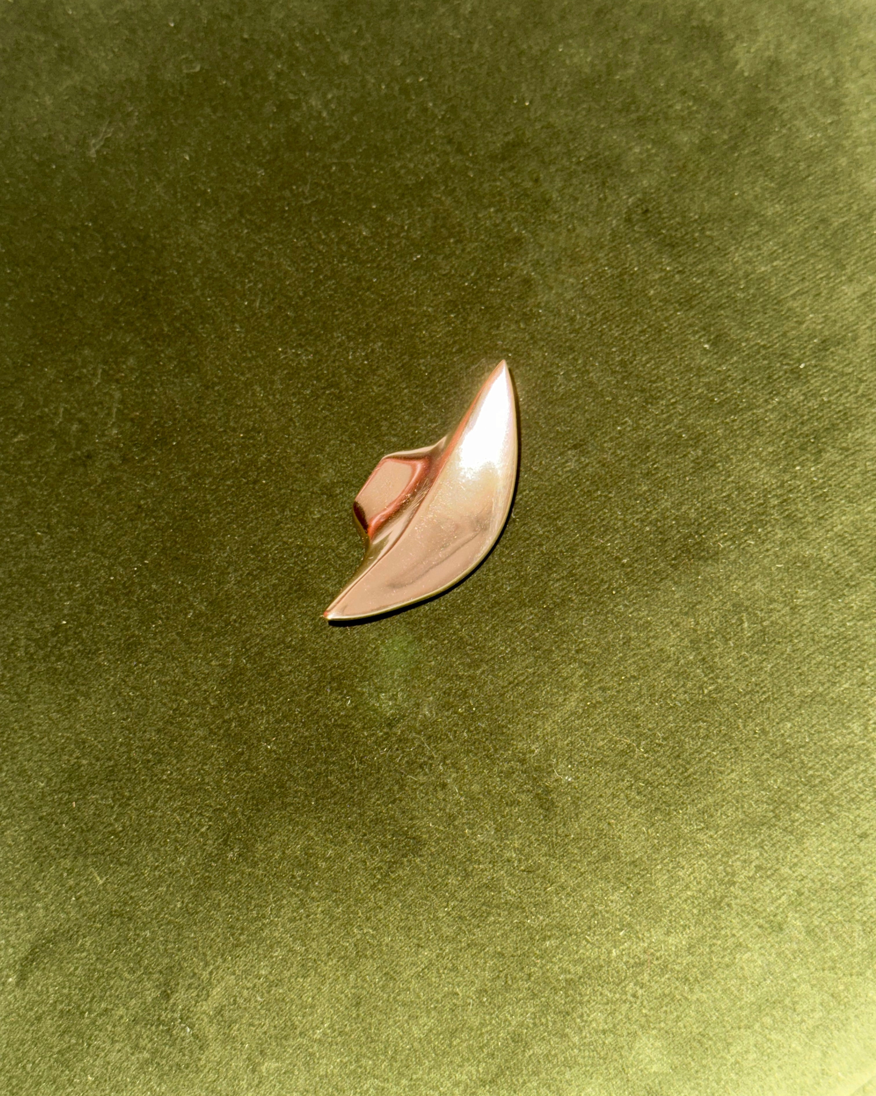 PETAL Knob/Hook — close-up of polished pink metal surface