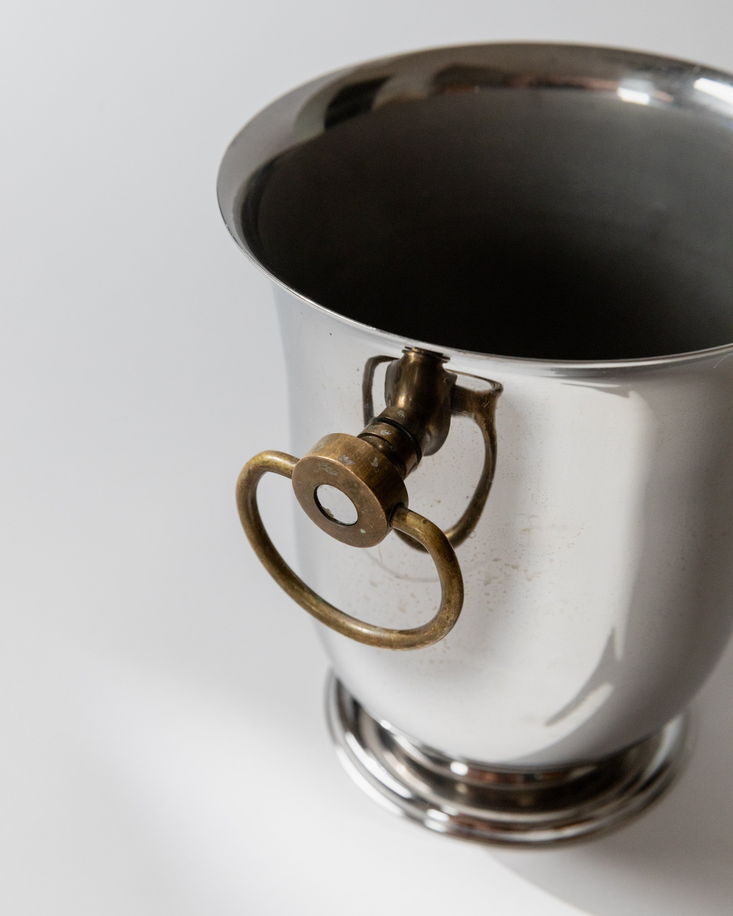 Brass handle detail of Jean Couzon silver champagne cooler