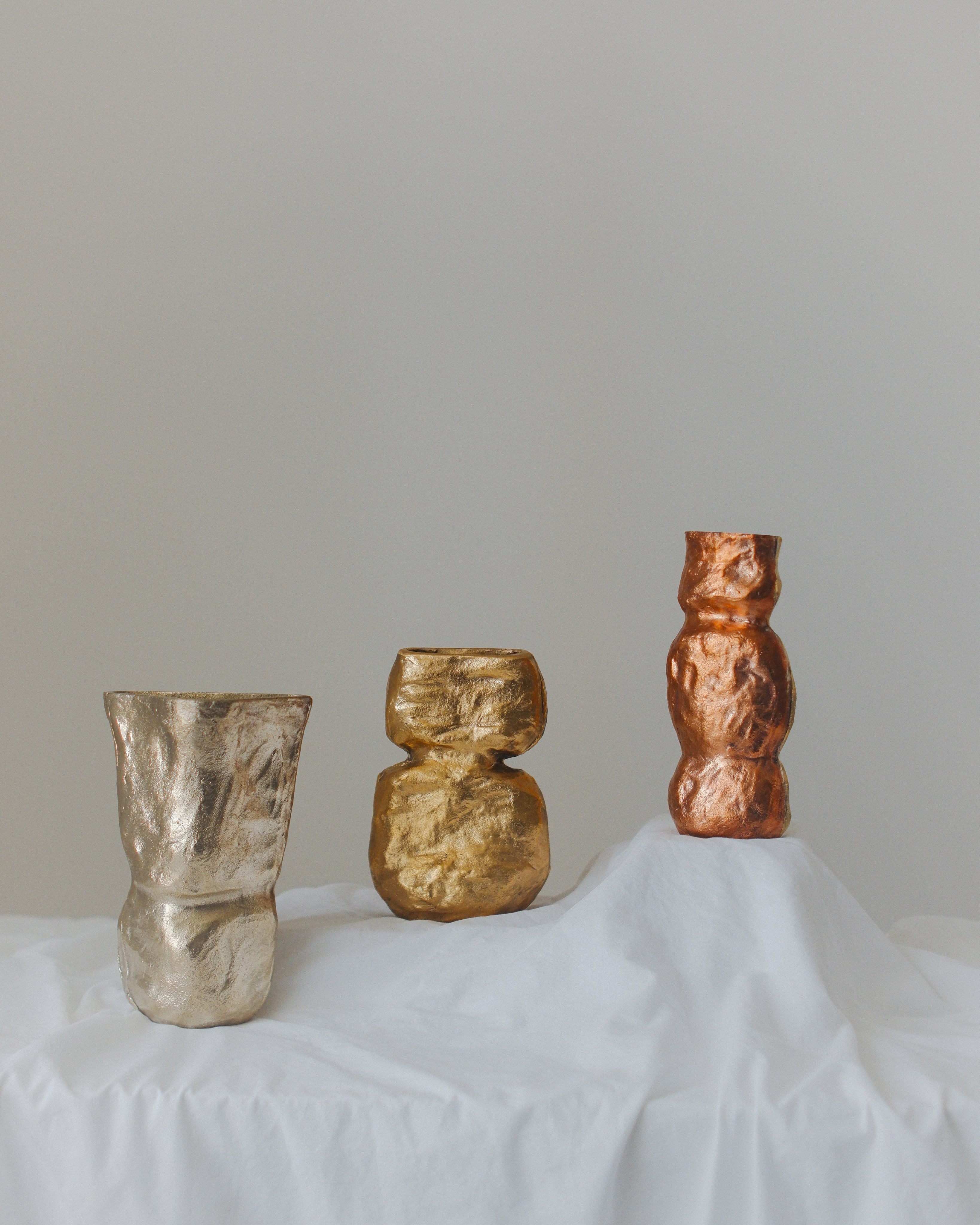 OLIO Vase No. 4 — back view showing textured metallic finish