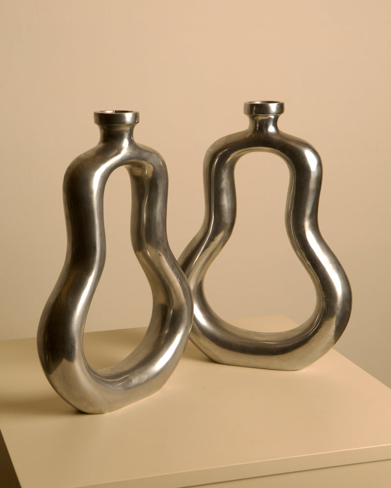 Pair of Italian Cast Aluminum Vases 1980s — close-up of shiny aluminum surface
