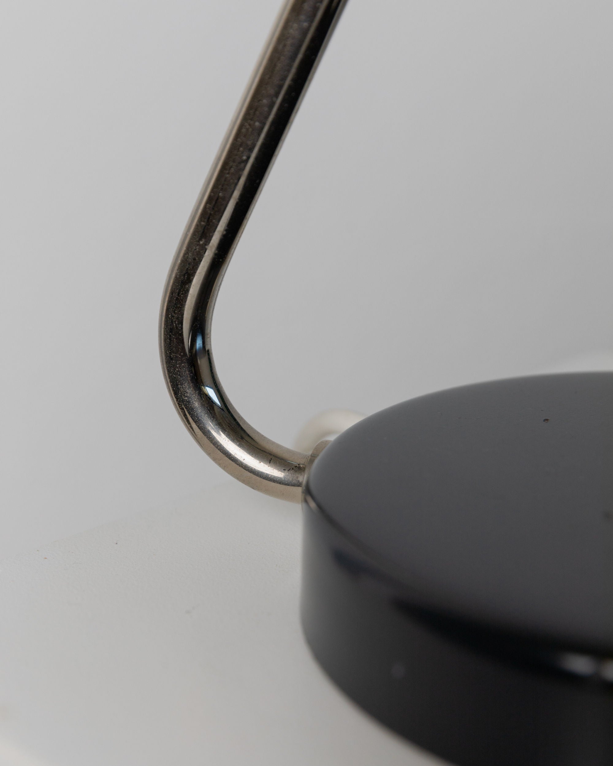 Table Lamp by Kaiser Idell, 1960s — close-up of black base and metal arm
