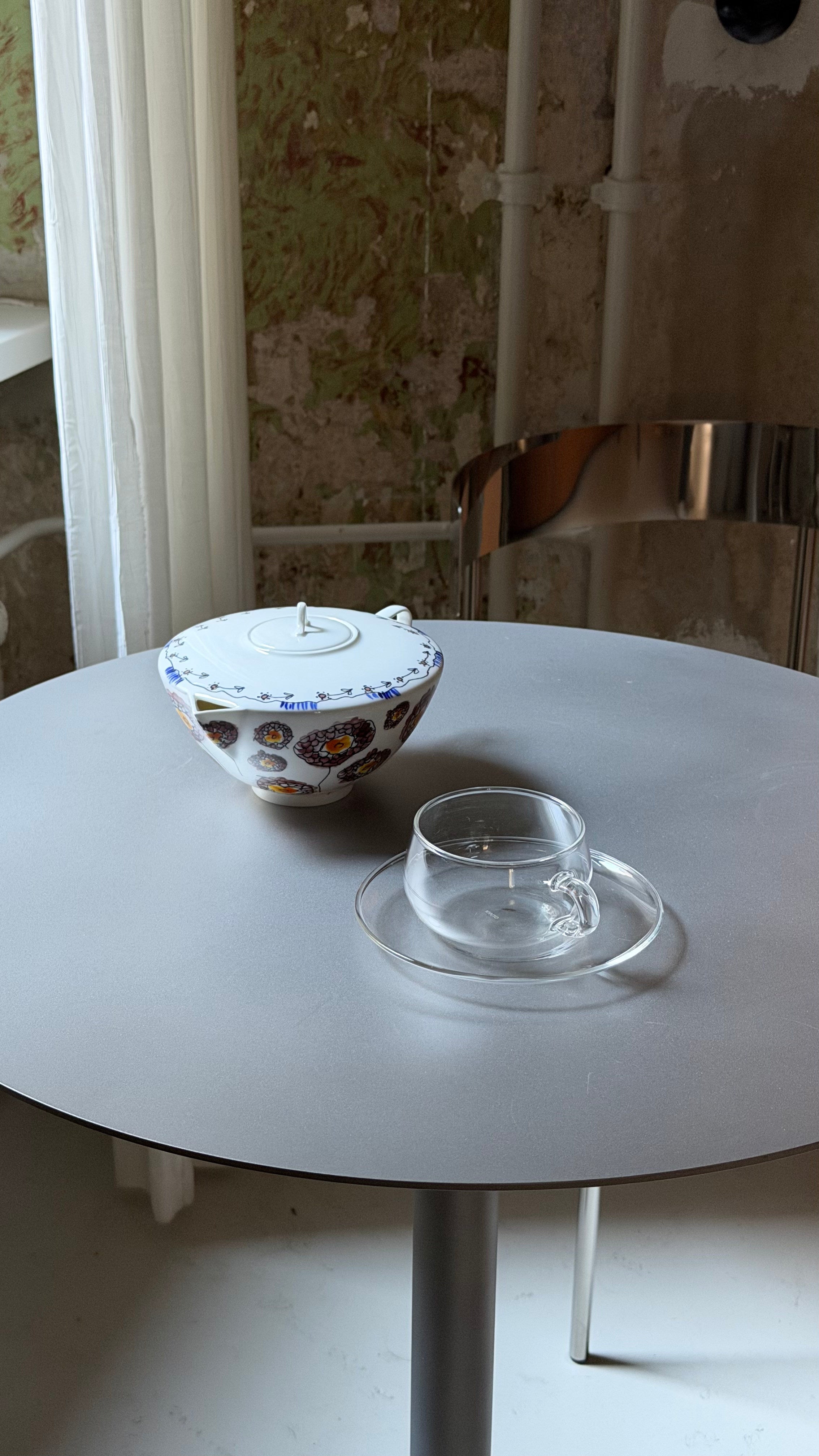 Table - Isla x Paul Delrez - Stainless Steel — top view with glassware on table