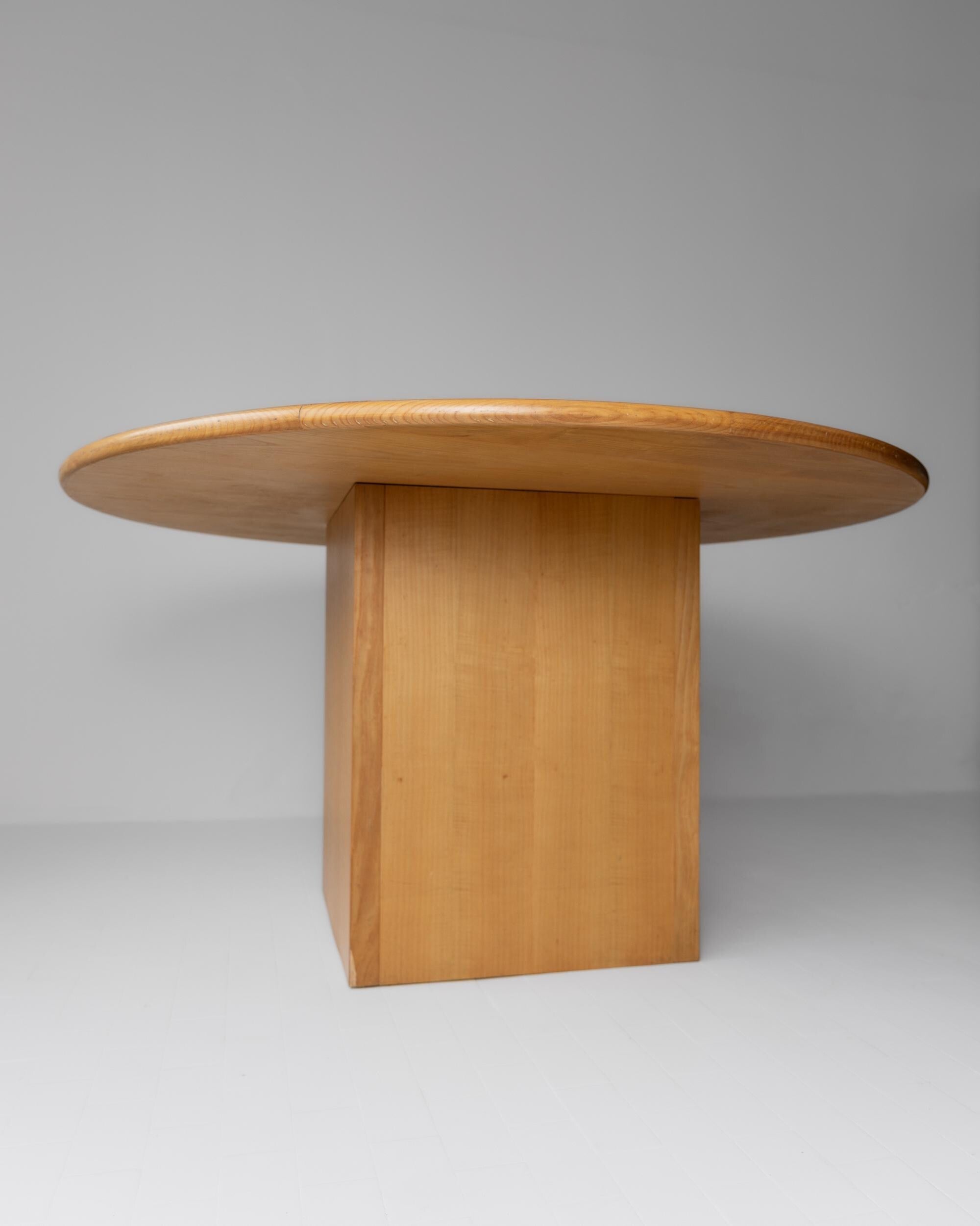 1980s Large Round Wooden Table — angled view of natural wood finish