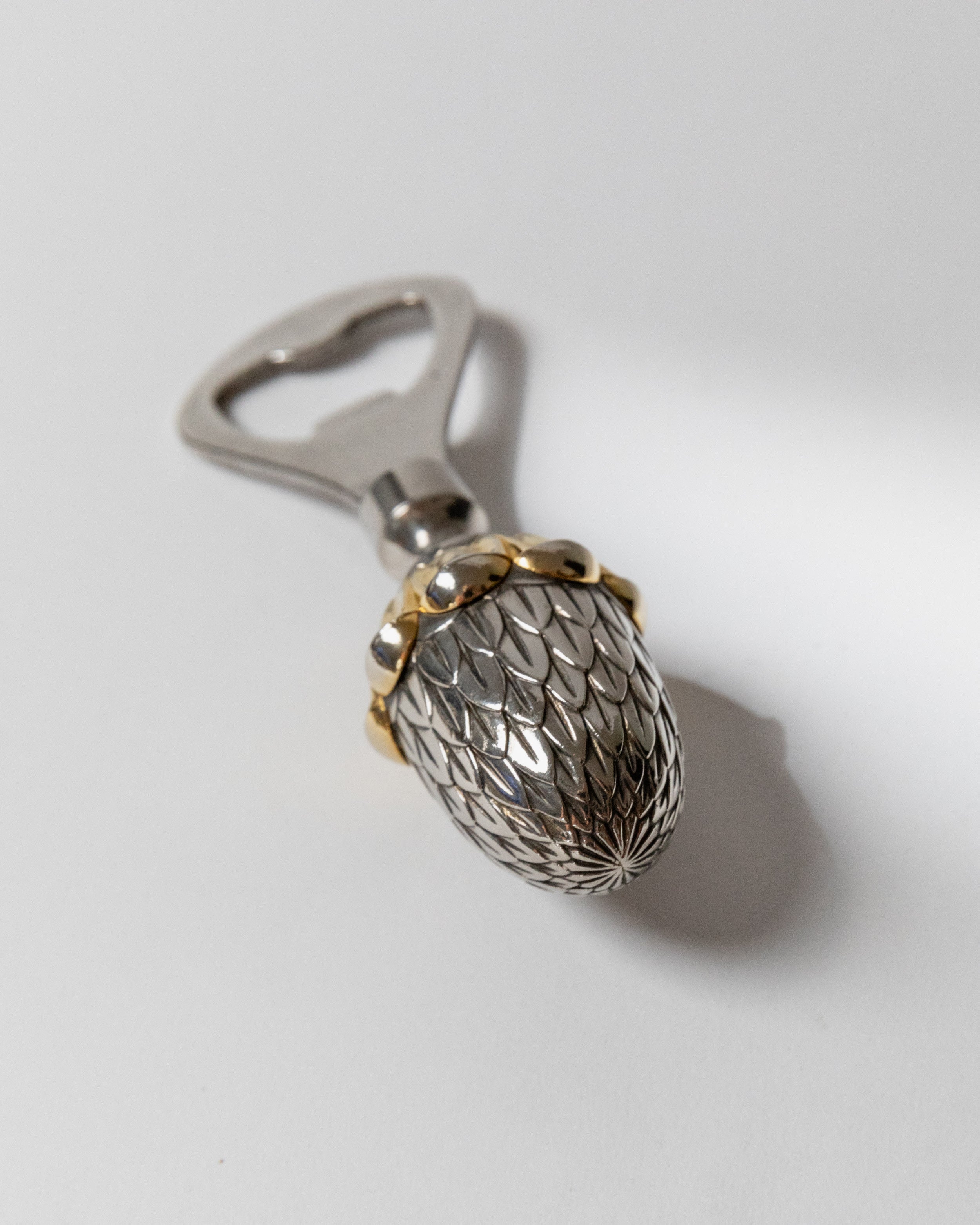Italian silver plated bottle opener with textured acorn design detail