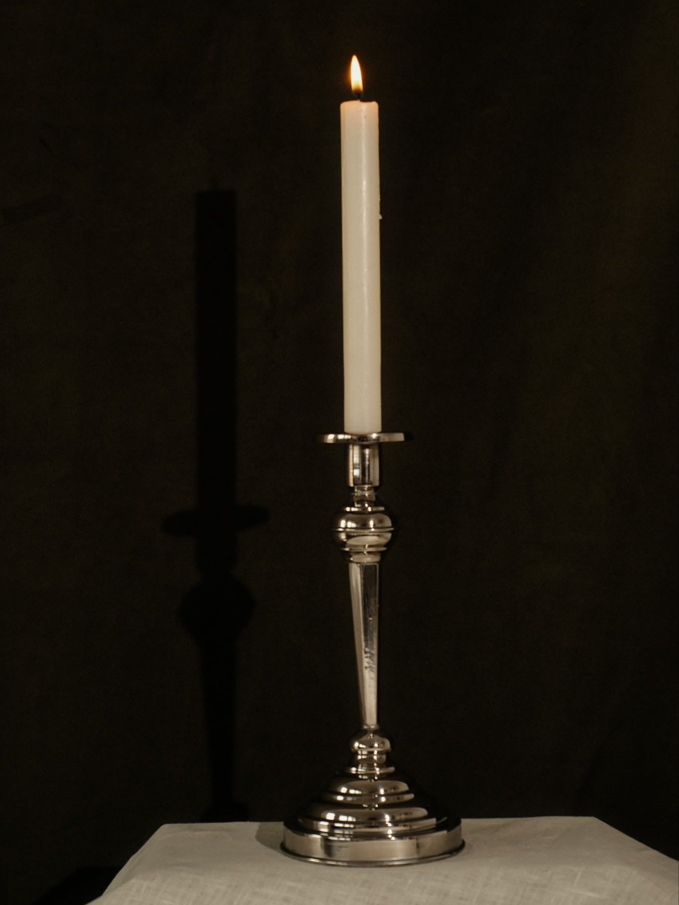 Set of 4 Stainless Steel Candlesticks — side angle