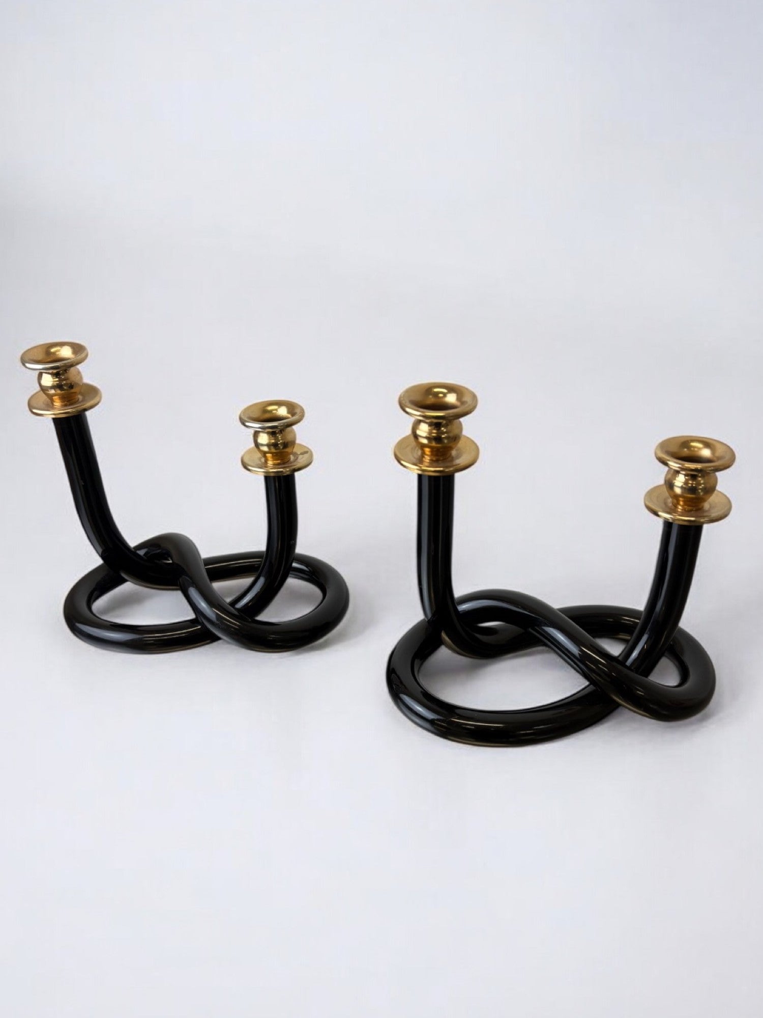Pair of Black Candleholders by Dorothy Thorpe, 1970s — side angle showing glossy black finish and brass tops