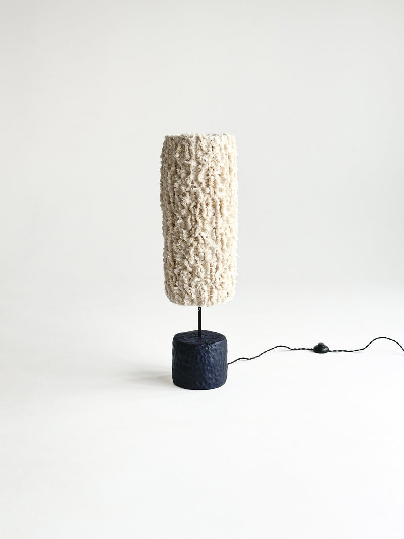 Bavo Sculptural Floor Lamp — close-up of textured cream shade and black base