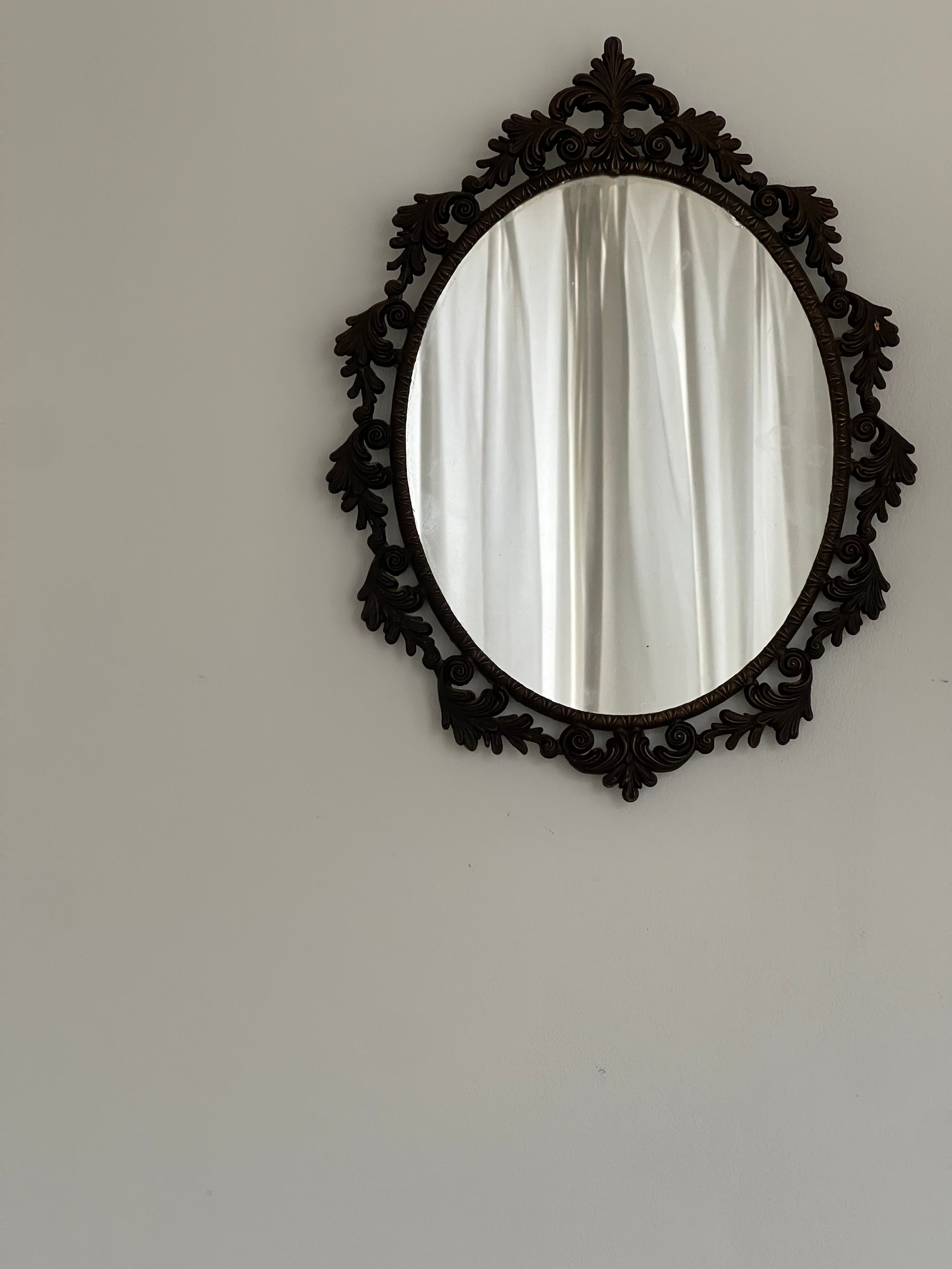 Ornate Vintage Oval Mirror, Rococo Frame — close-up of dark wood frame