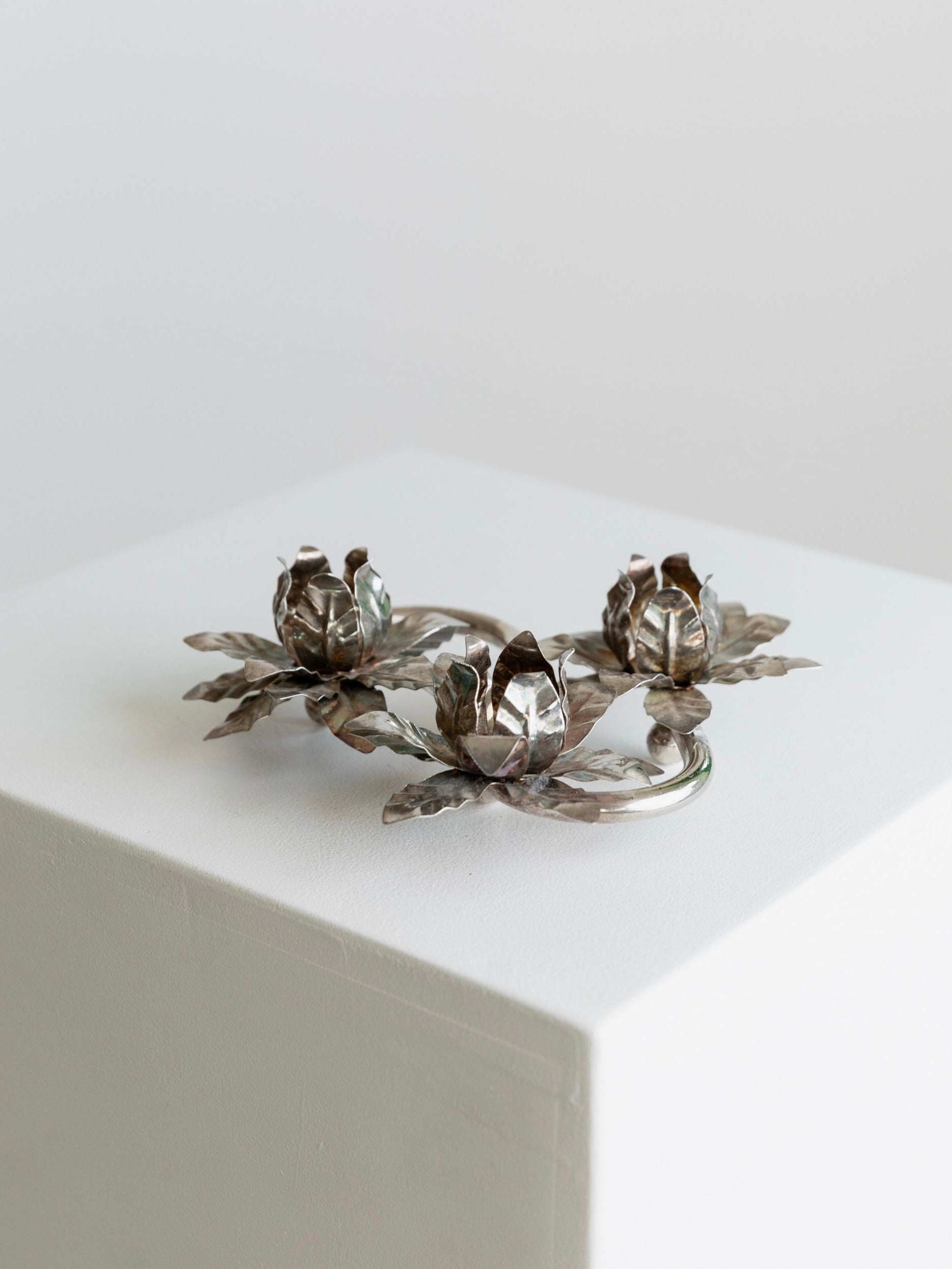Silver Plated Vintage Candleholders — top view on white pedestal