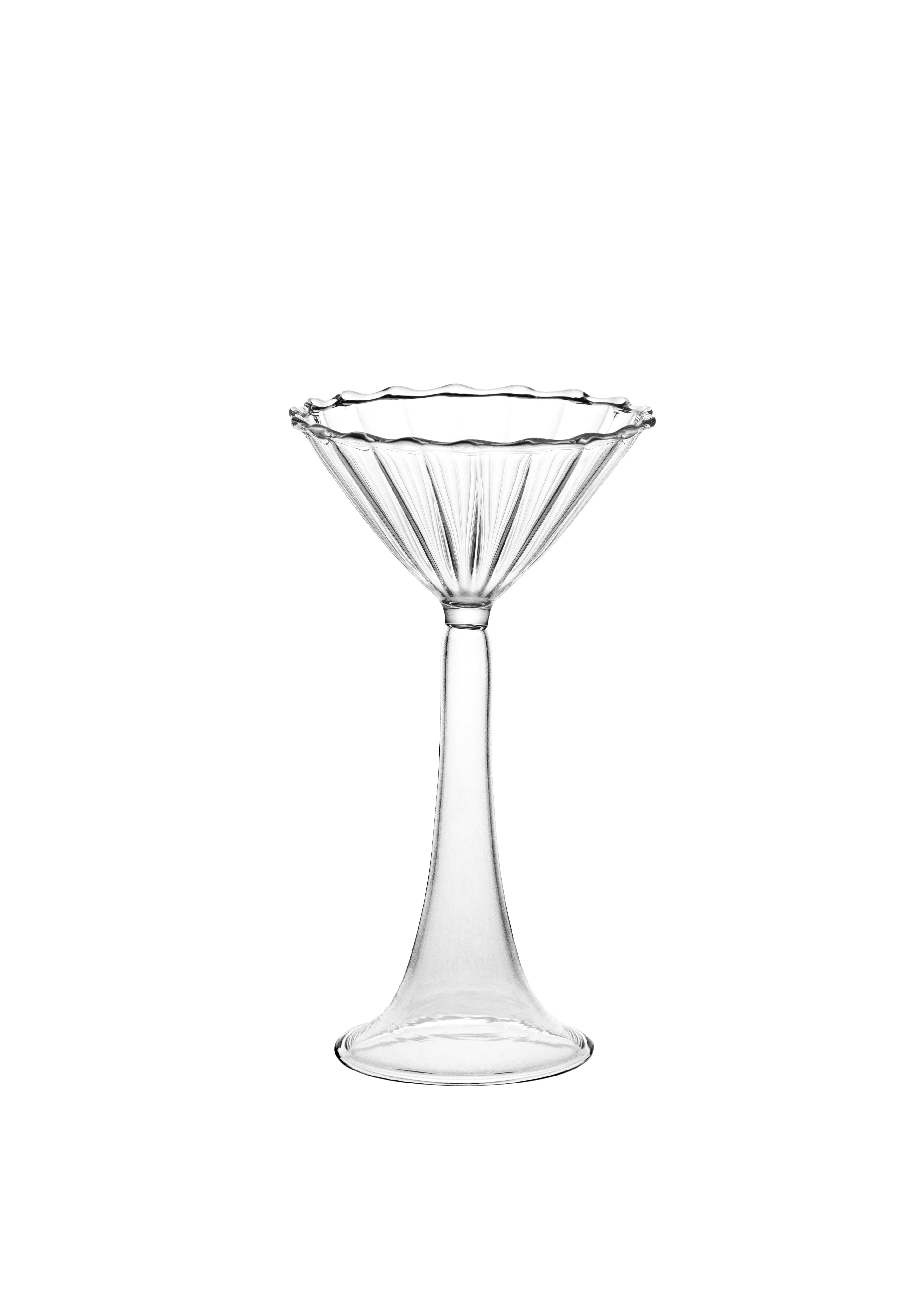 The Campanula — Clear Cocktail Glass by Agustina Bottoni is a handmade Italian coupe with a scalloped rim, fluted bowl, and tall stem, crafted from clear borosilicate glass and shown against a white background.