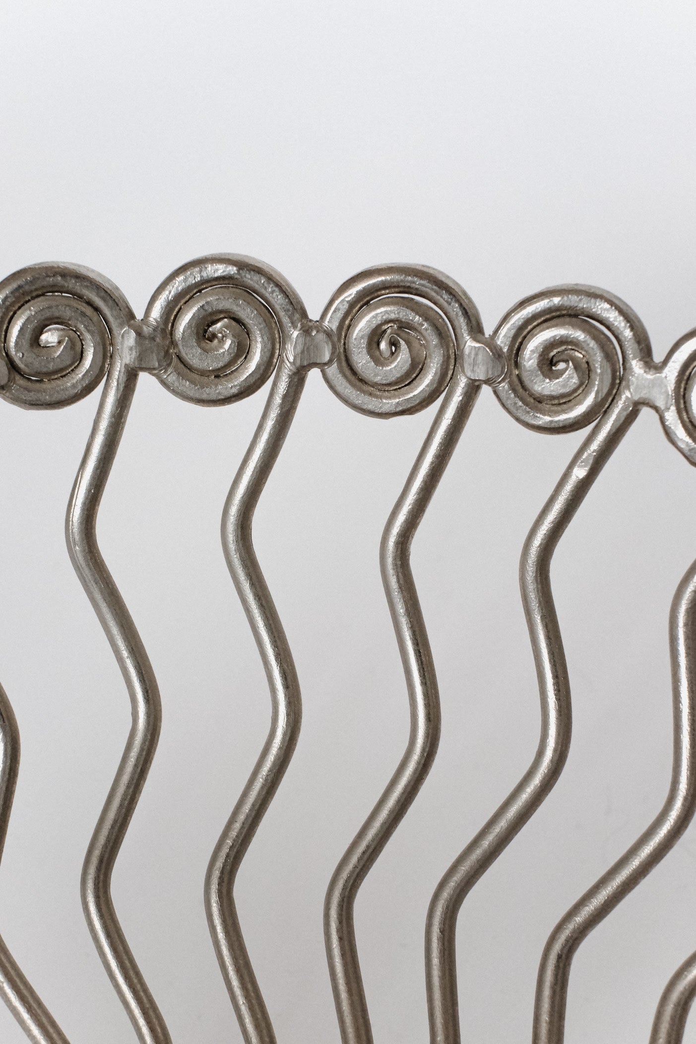 Large Decorative Bowl — side angle showing metal spiral design