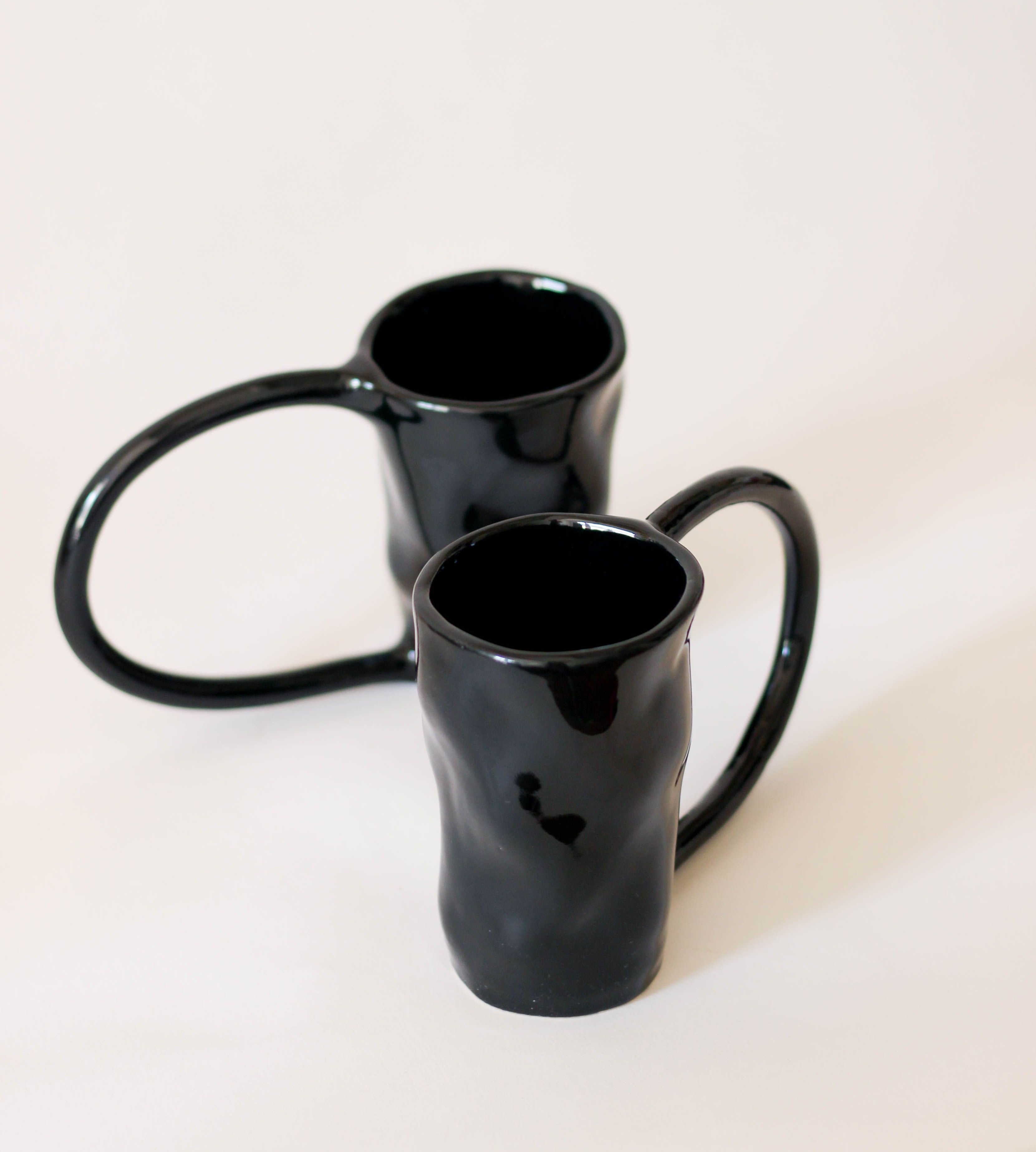 Large Stoneware Coffee Mug — close-up of glossy black surface