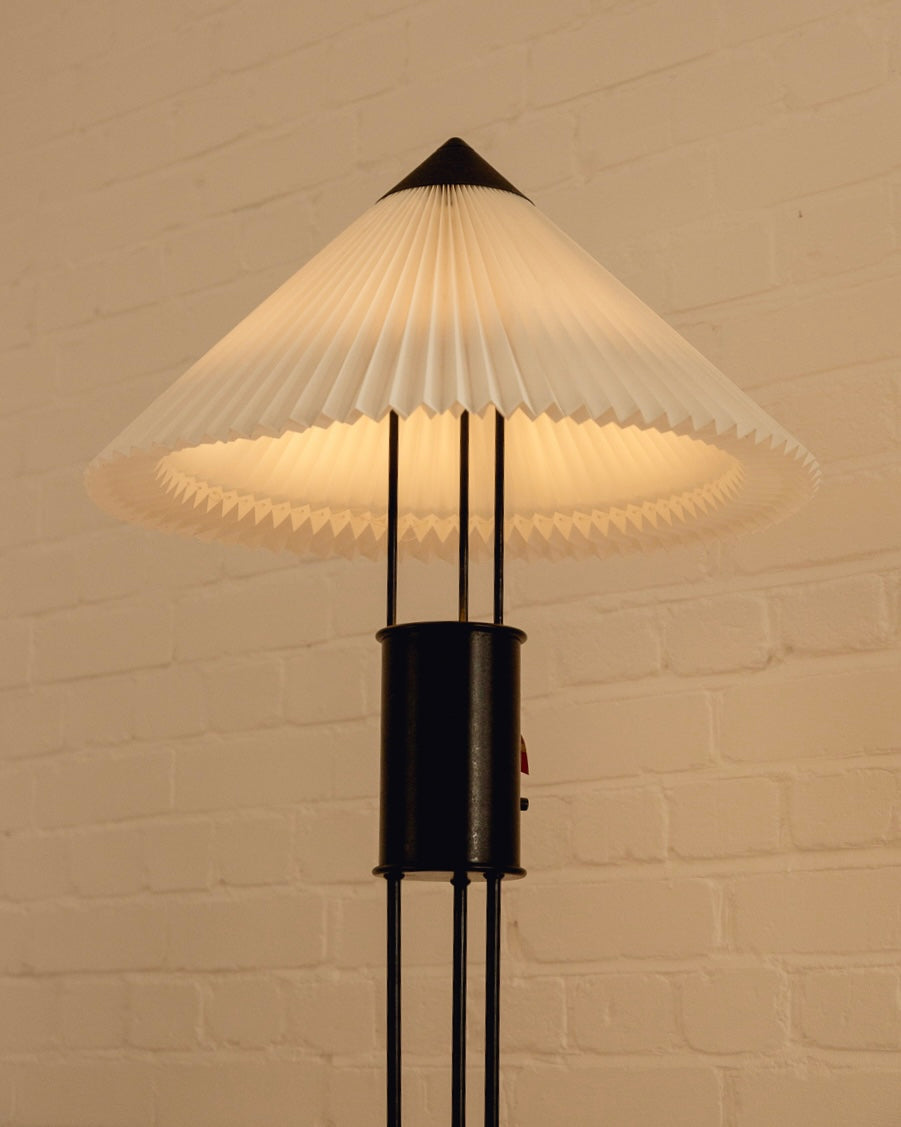Le Klint Floor Lamp — close-up of pleated white shade and black base