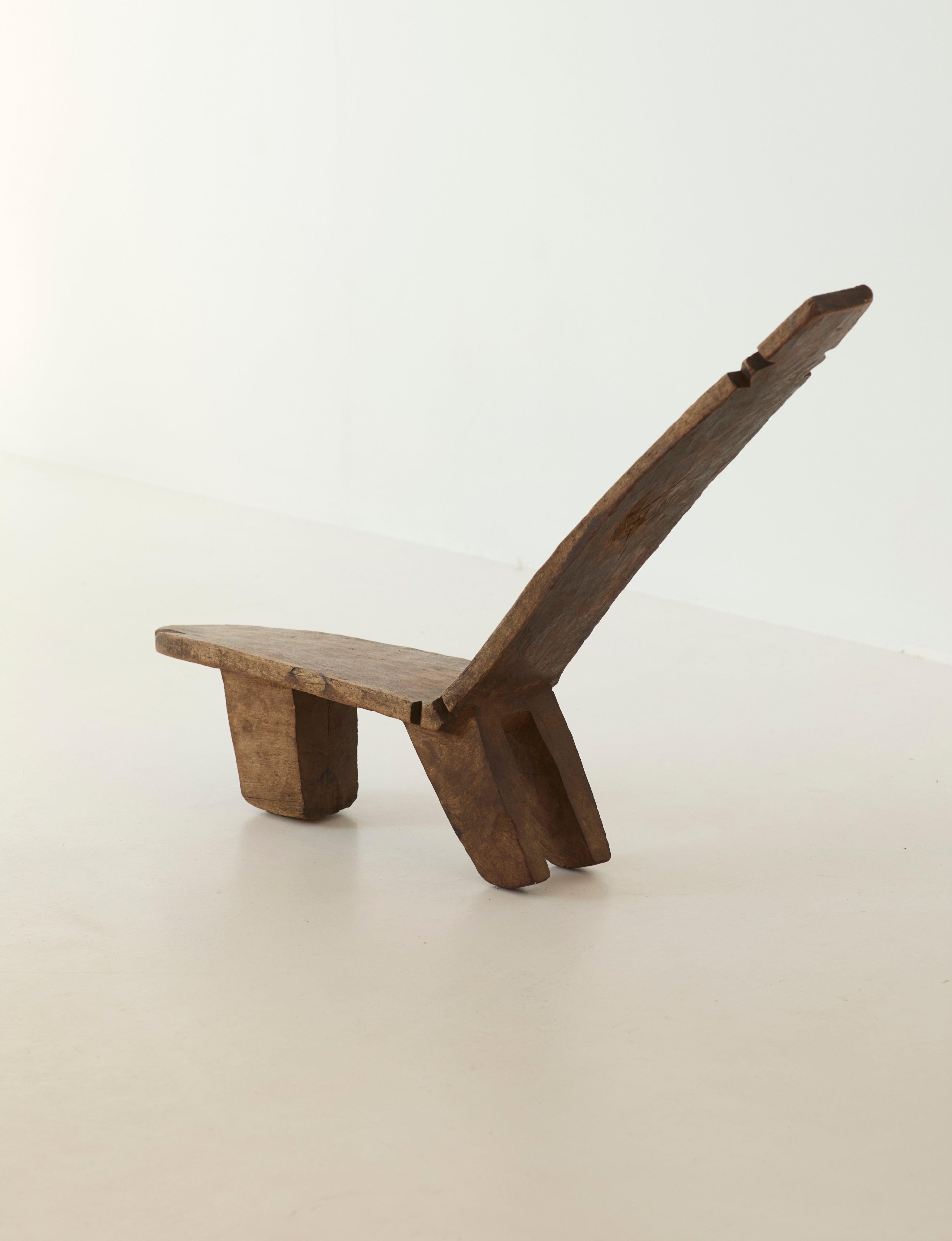 West African Monoxyle Lobi / Stargazer Chair, C. 1950 — side view on neutral background