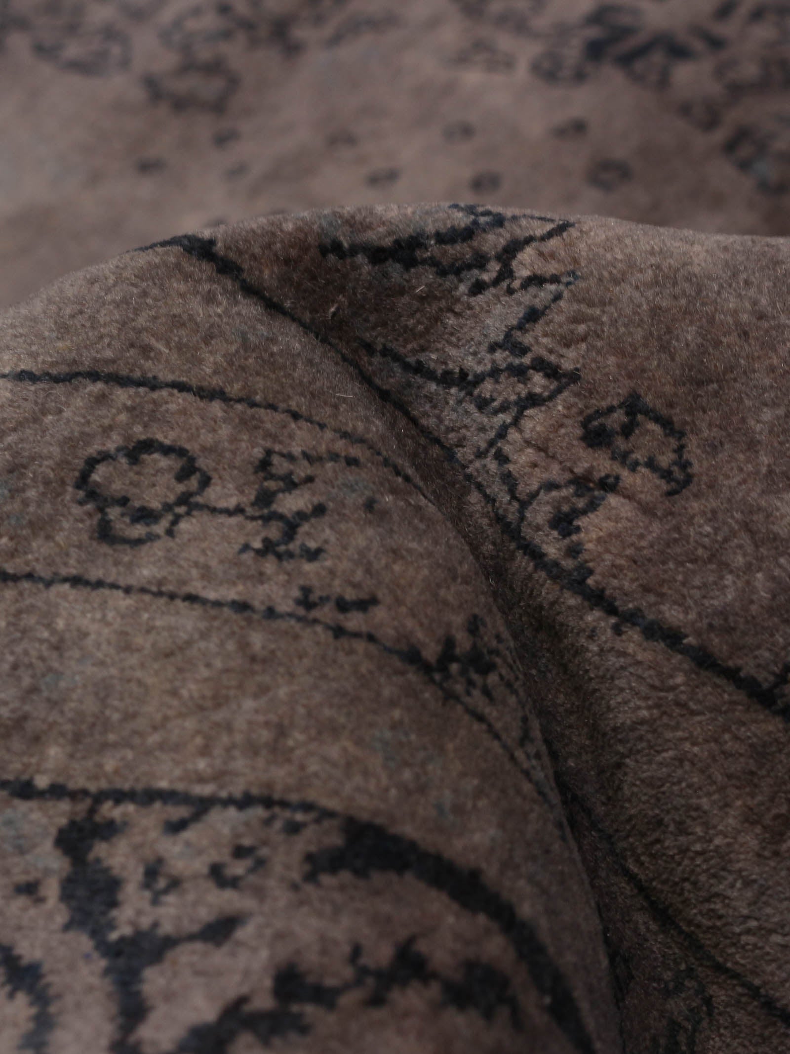 overdyed rug in mulberry 241 x 307 cm — detail view
