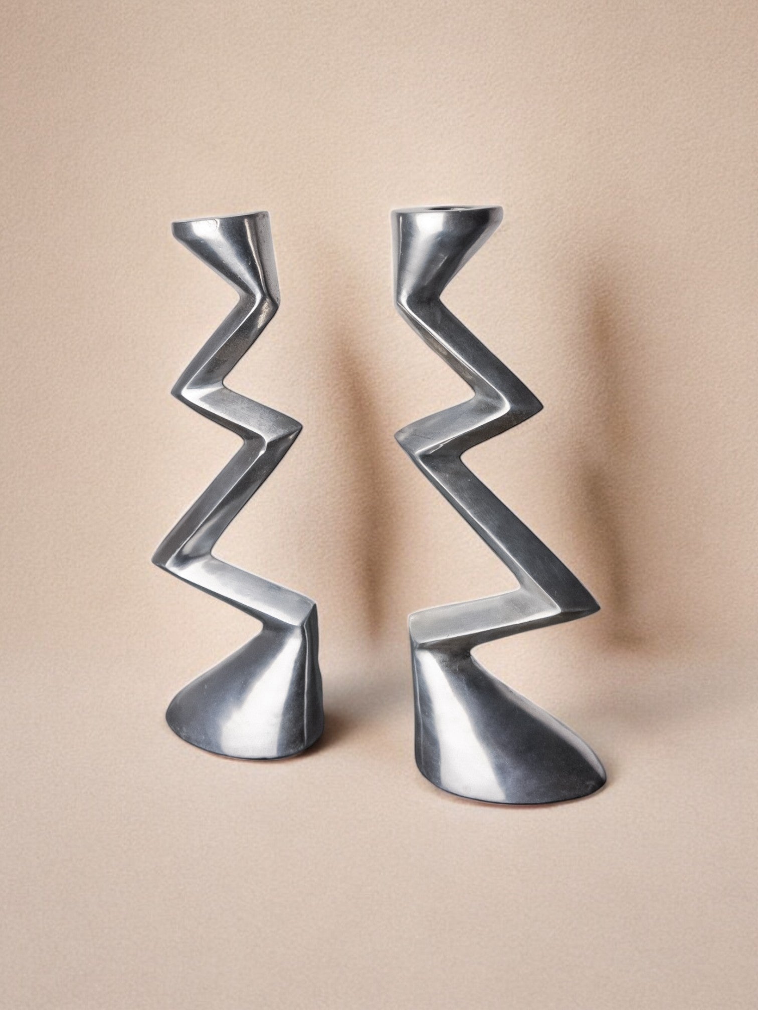 Pair of Zigzag Candleholders, 1980s — side angle highlighting polished metal finish