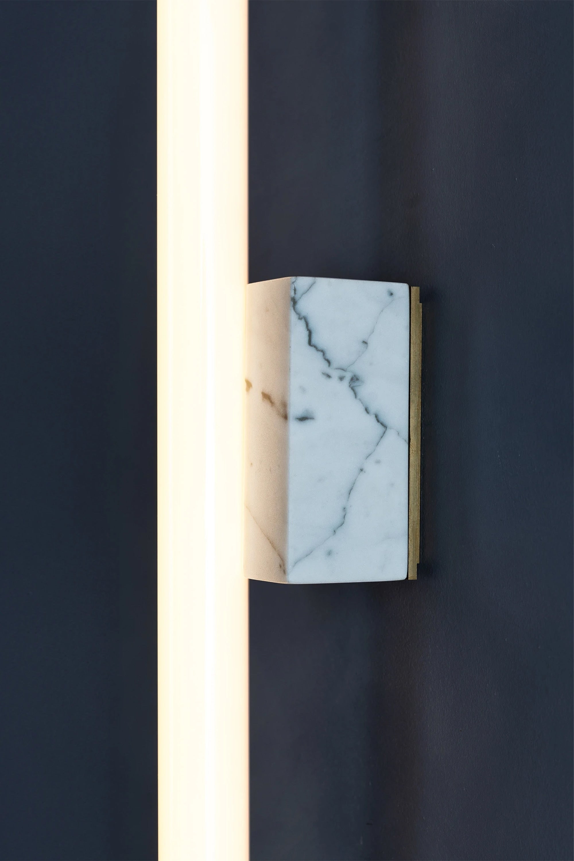 NEA MARBLE 50 — side angle showing marble base with brass detail