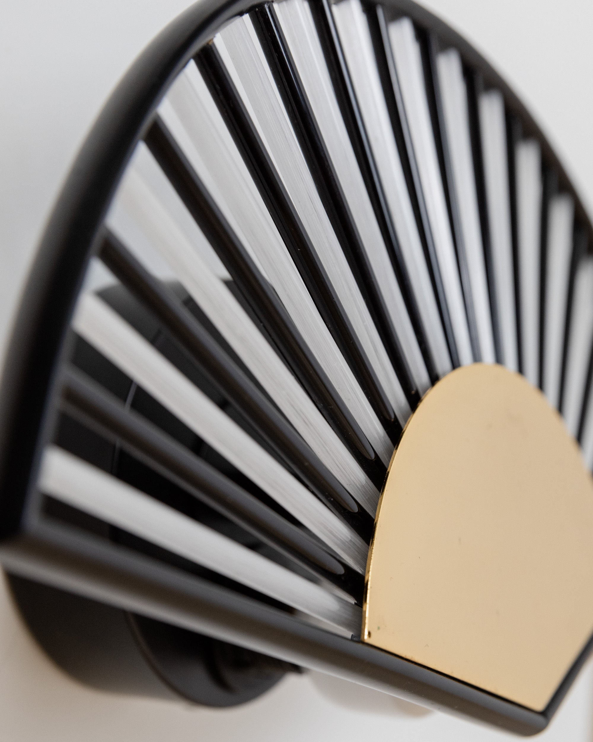 Wall Light Fan Shape, Italy 1980s — close-up of black and gold design