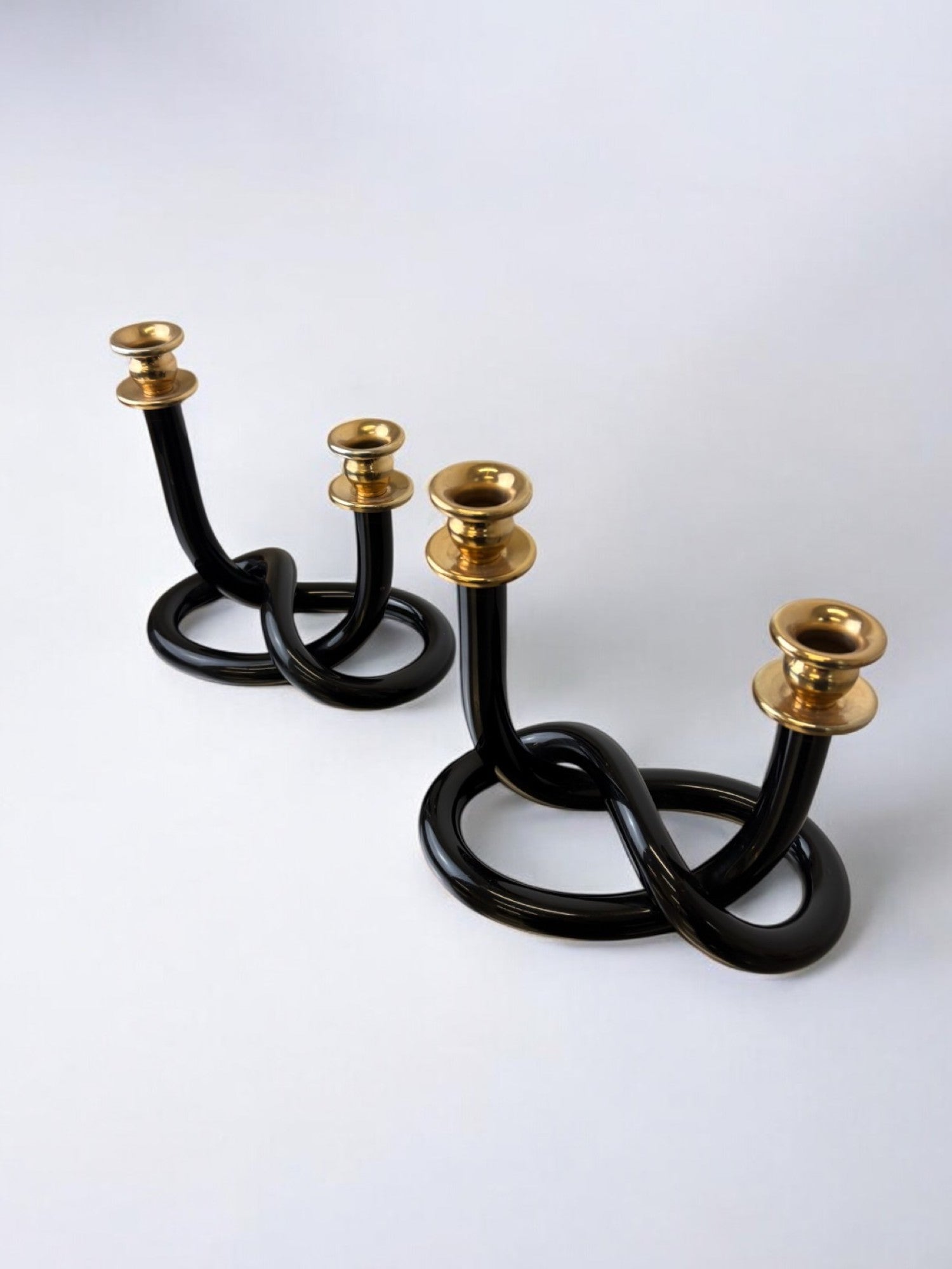 Pair of Black Candleholders by Dorothy Thorpe, 1970s — close-up of intertwined black design with brass tops