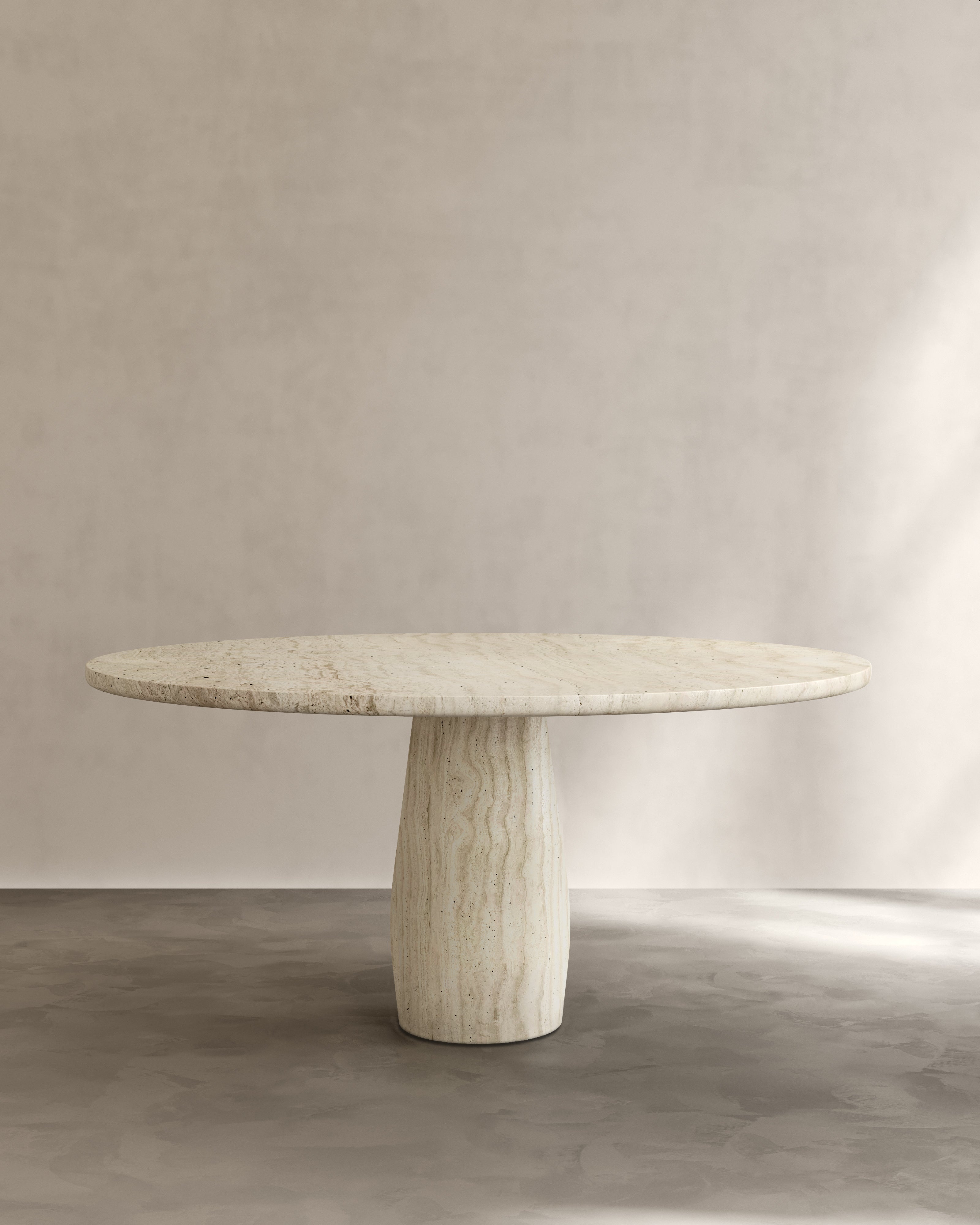 Raffaella Table III — round stone table in minimalist setting
