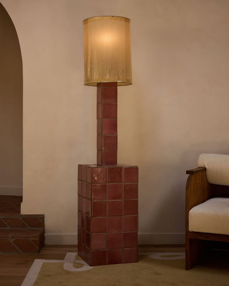 Jura floor lamp with red brick base and cylindrical glass shade
