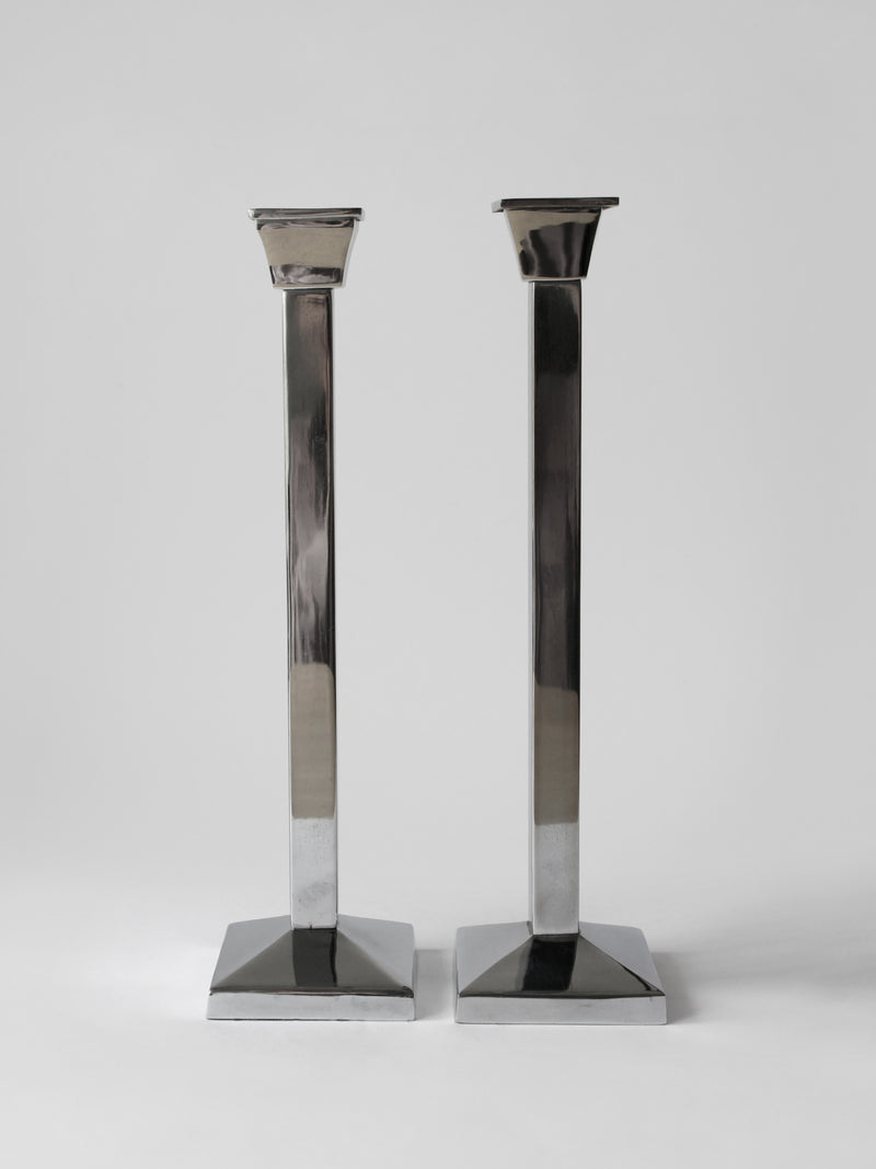 Pair Of Polished Mirror Metal Tall Candle Holders by Vintage Stories | The Oblist — polished metal finish, modern design