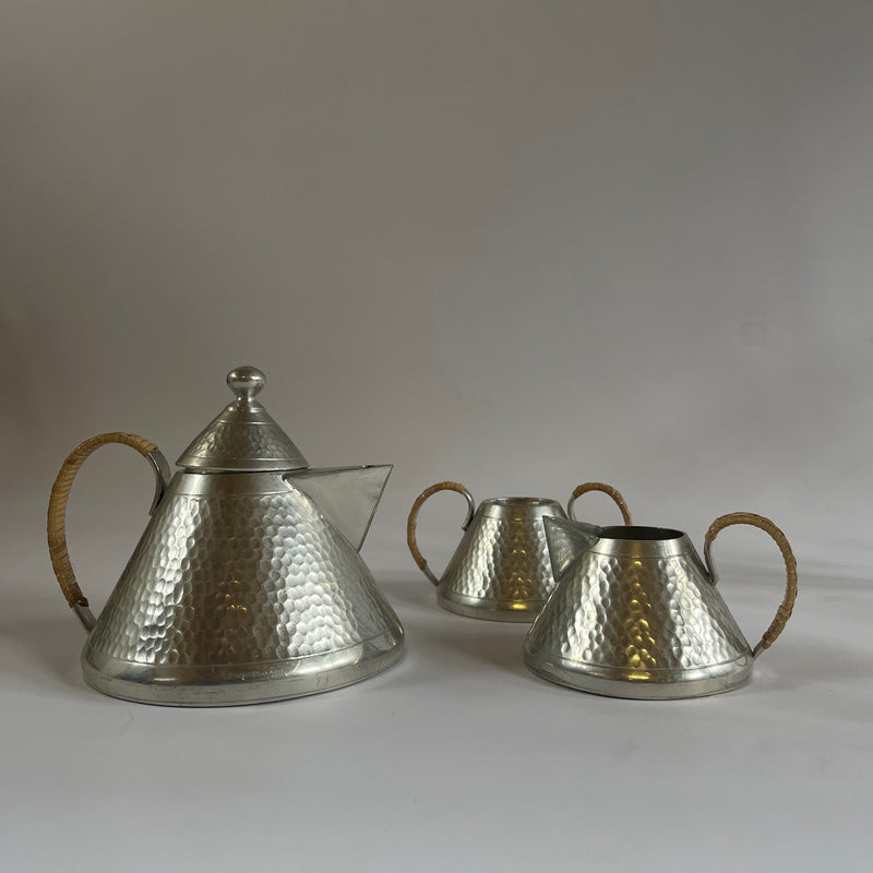 Art Deco Hammered Pewter Tea Set — close-up of textured pewter with woven handles
