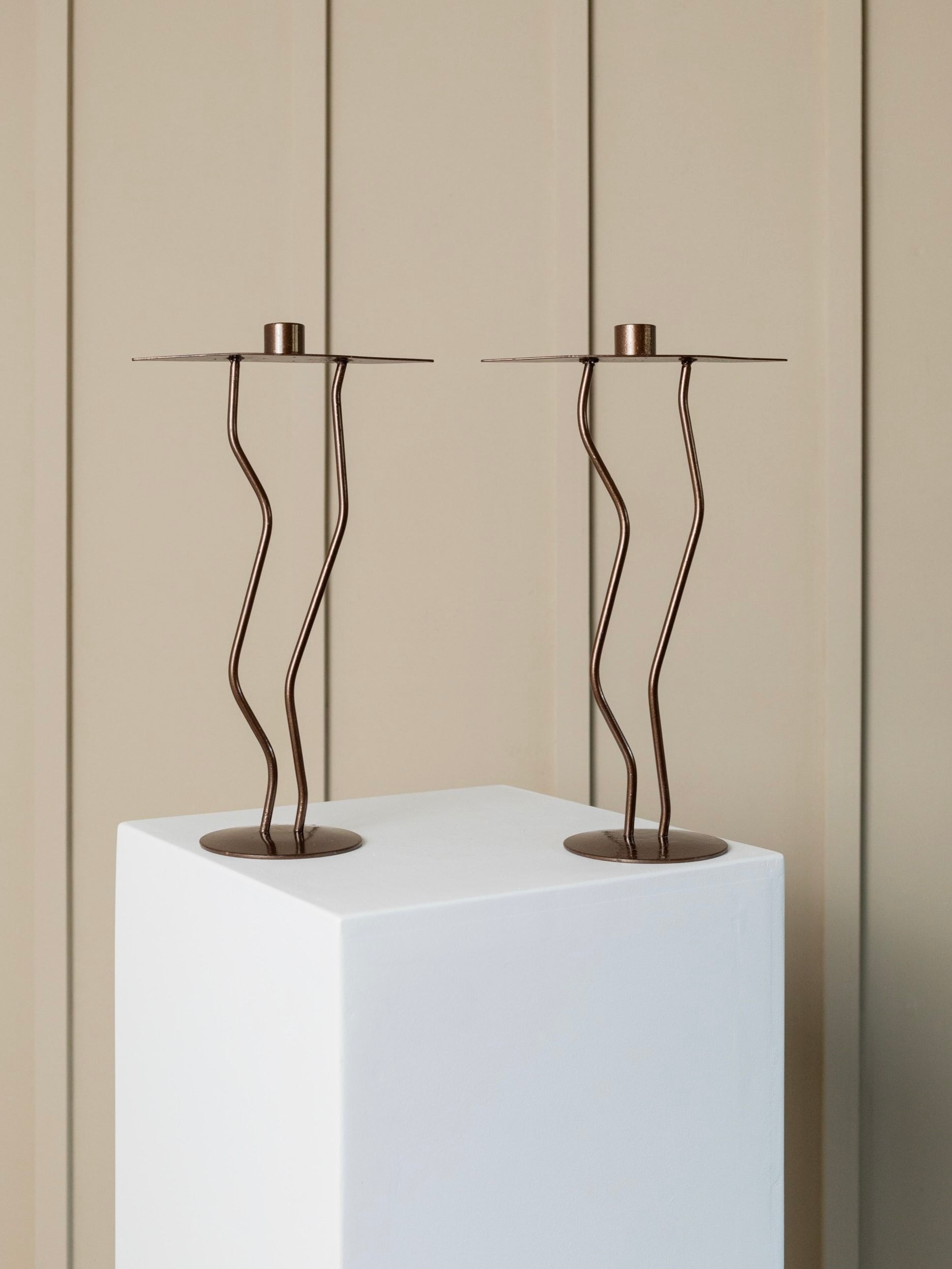 Two Metal Candlesticks Memphis Style — side angle on white pedestal