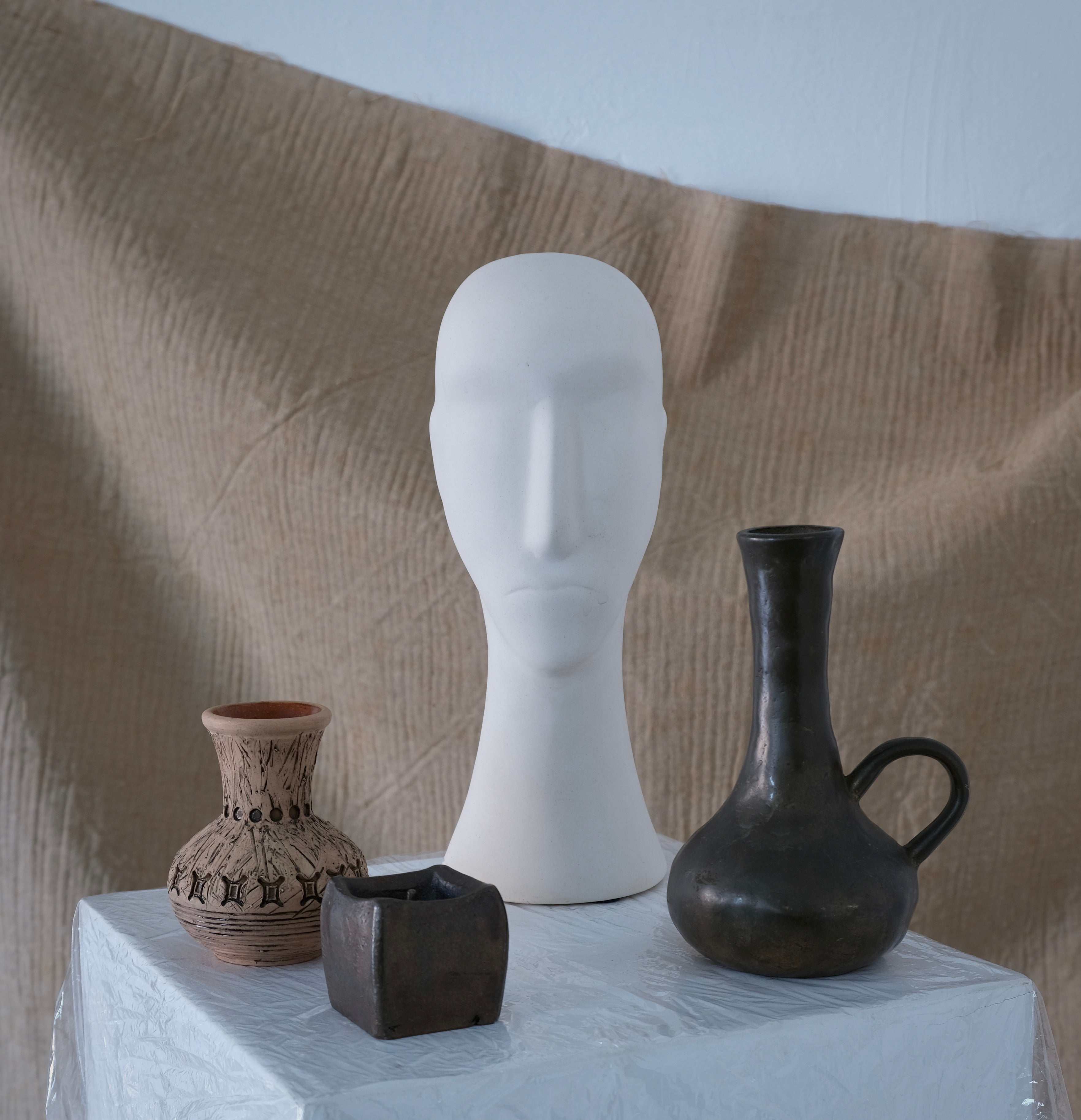 Brutalist Cast Bronze Candle Holder & Vase Set, 1970s — close-up of bronze vase on textured surface