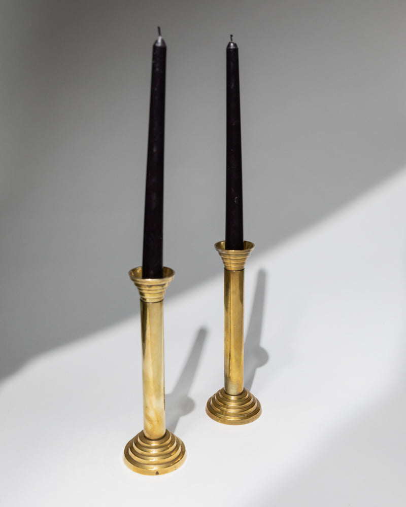 Pair of brass candlesticks with black candles, 1960s vintage