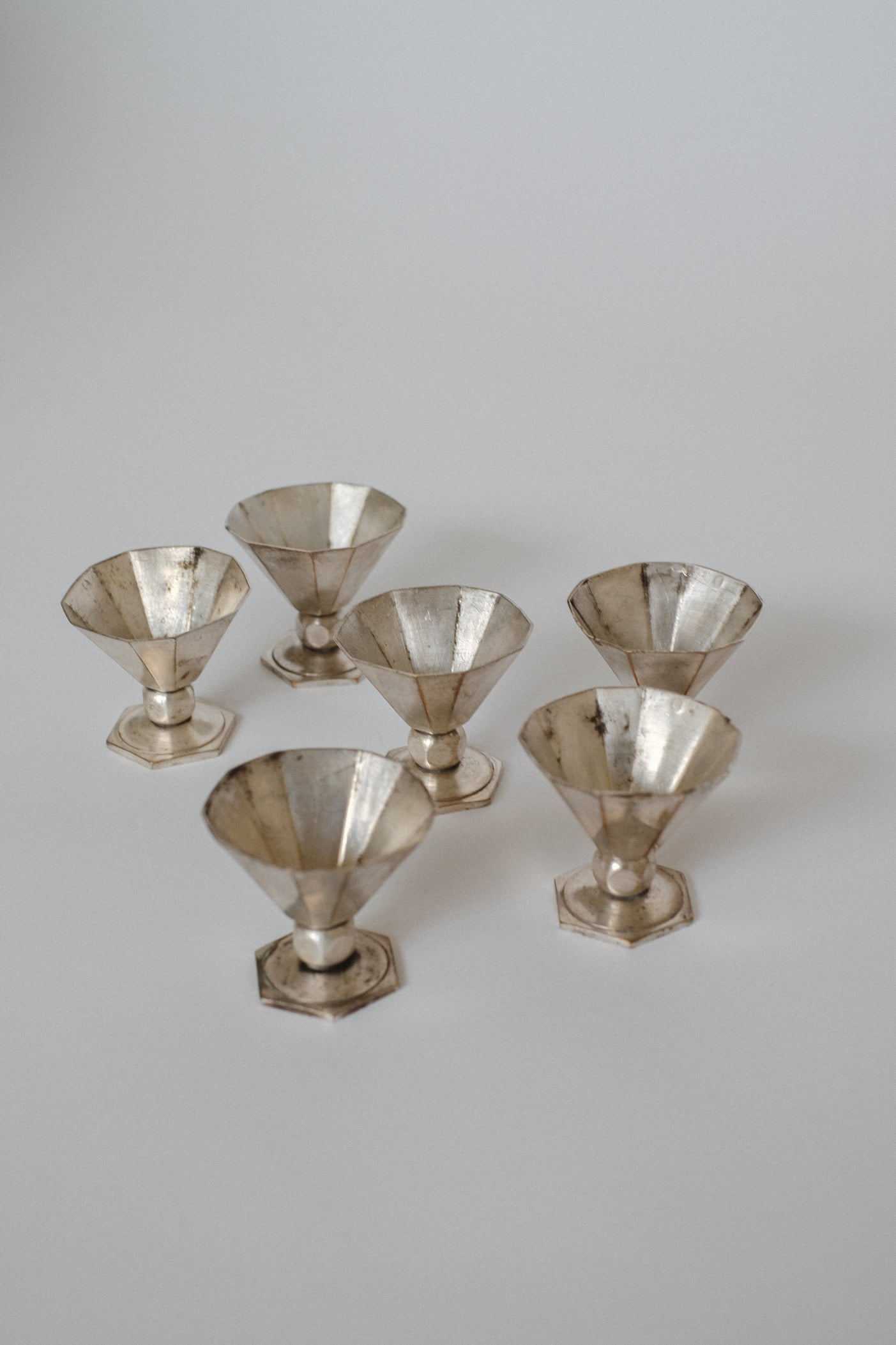 Art Deco Small Cups — arranged in a circle on light background