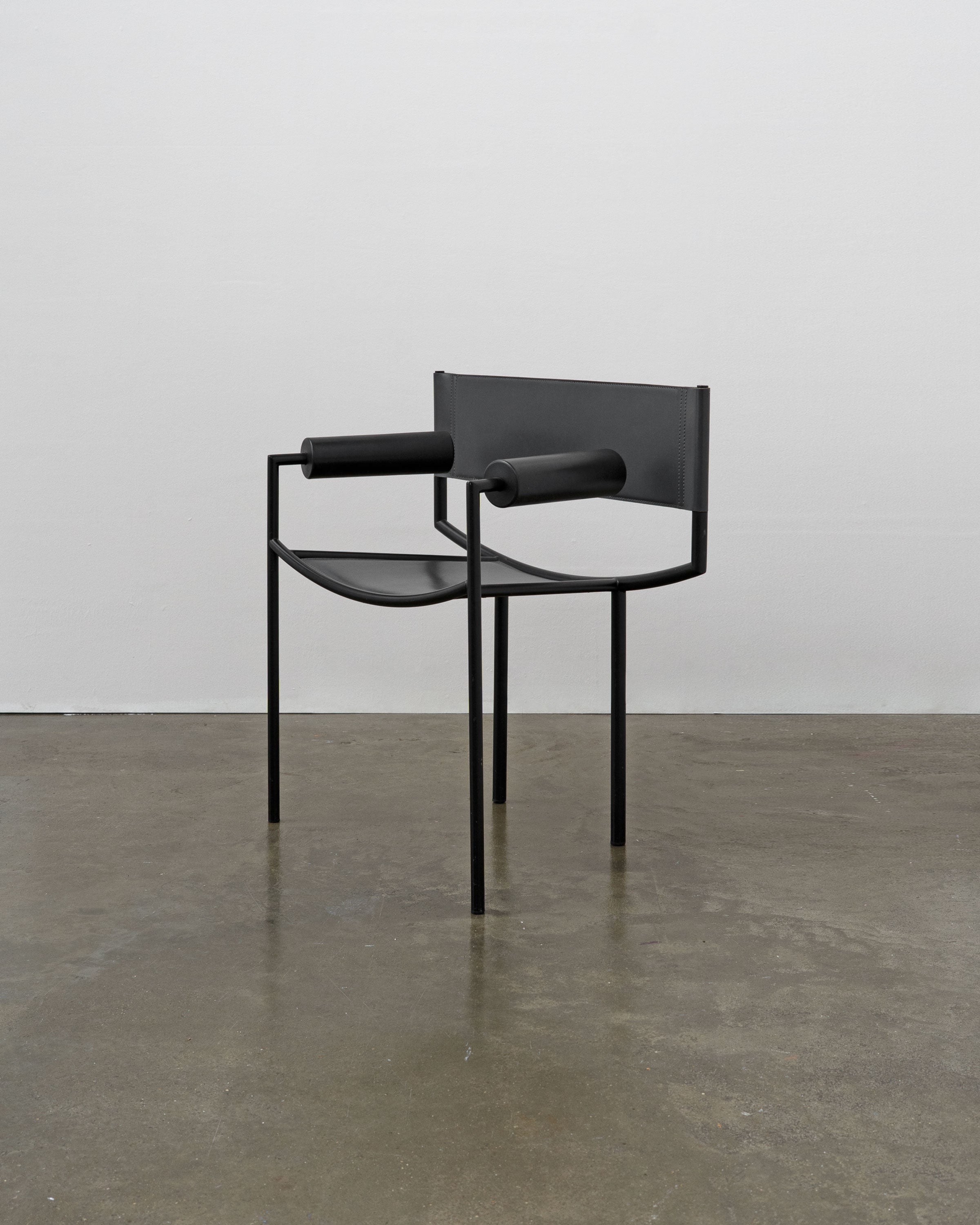 Postmodern Leather and Steel Chair, 1980s — angled view on concrete floor