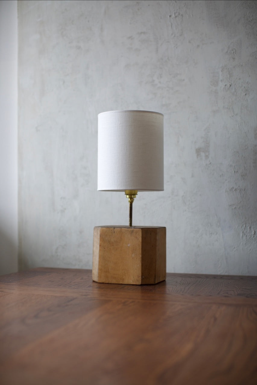 1960's Table Lamp — angled view on wooden table with concrete wall