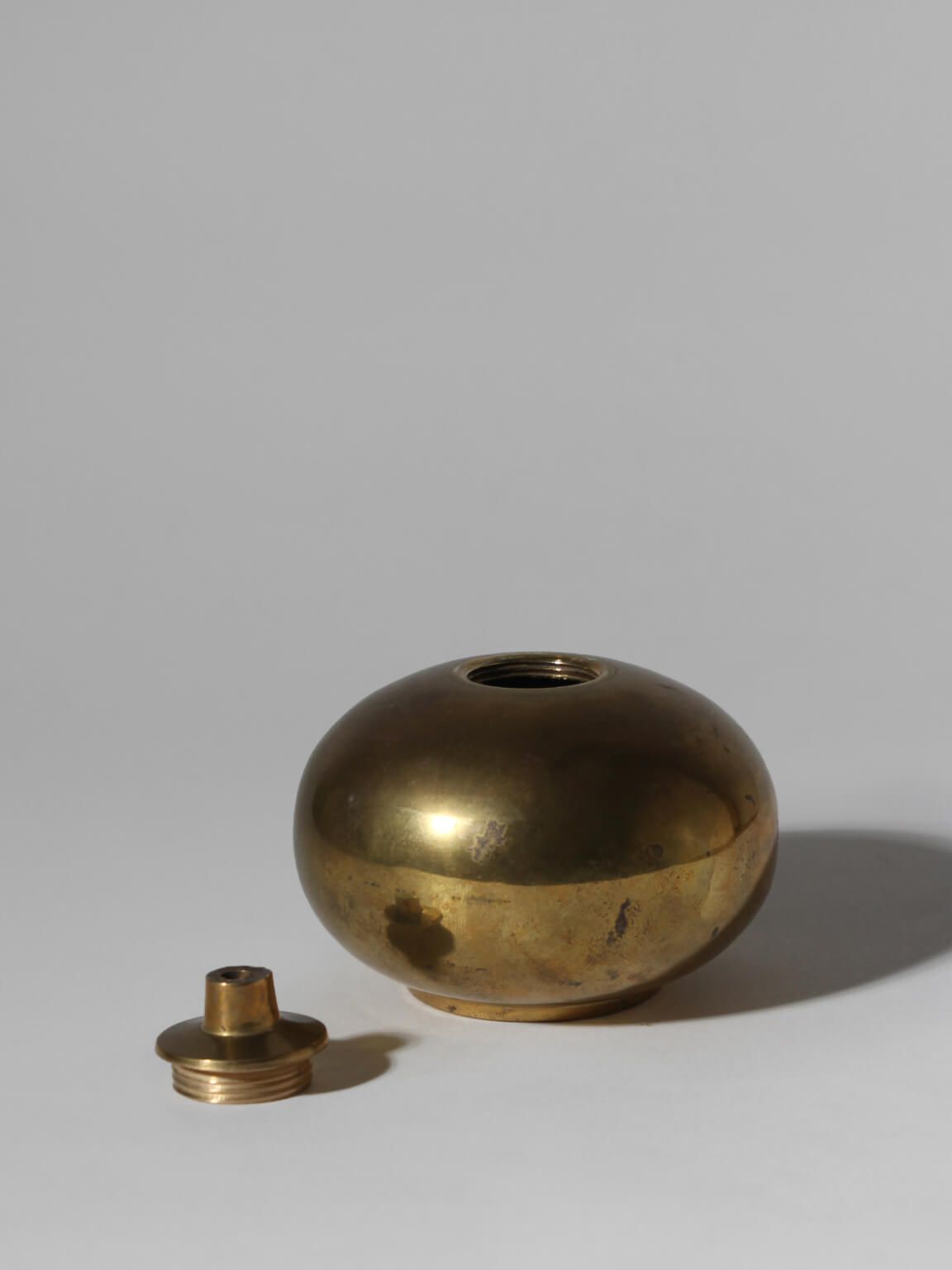 Brass Oil Lamp, Small — angled view of polished brass surface