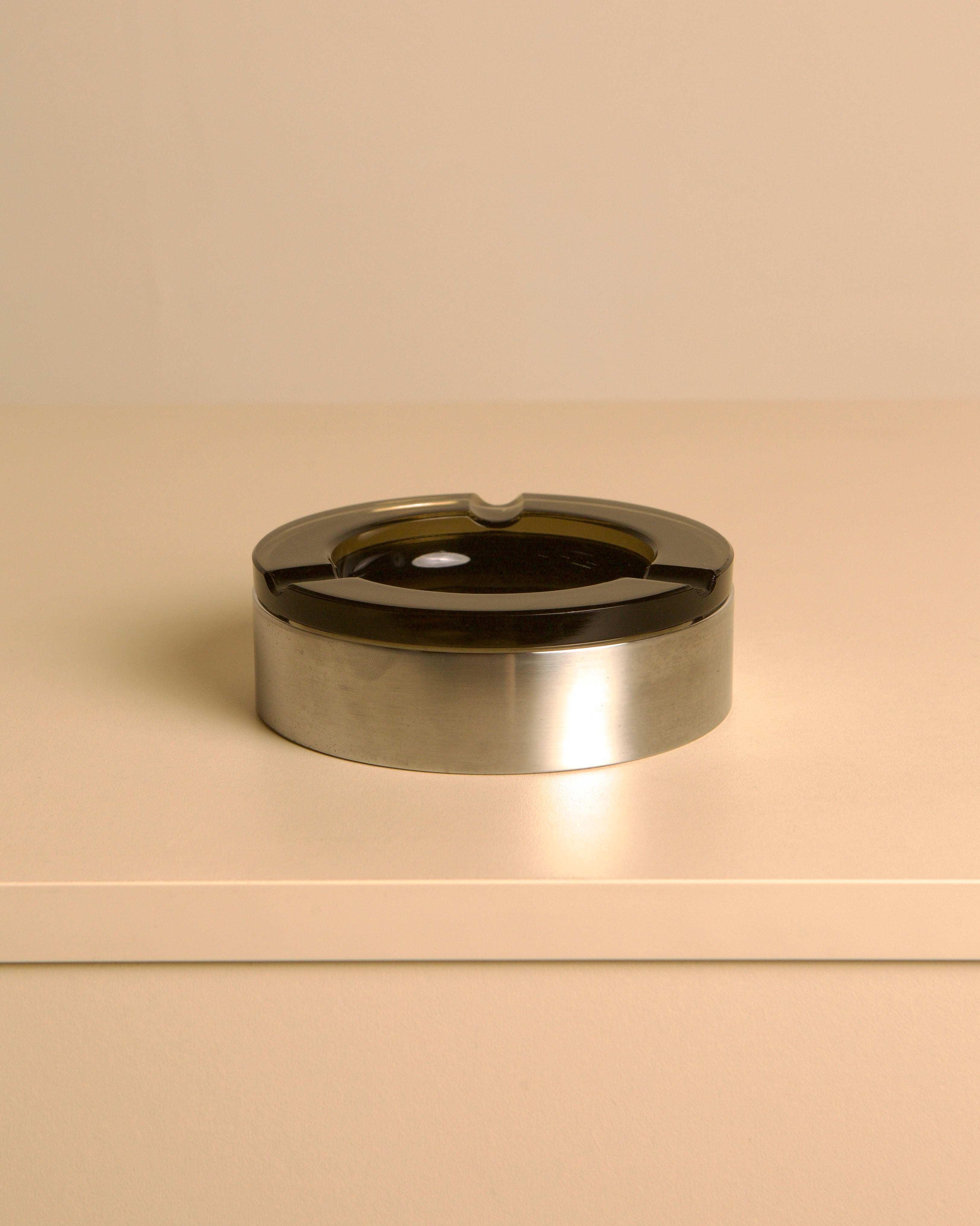 Italian circular metal and amber glass ashtray, 1970s — detail view