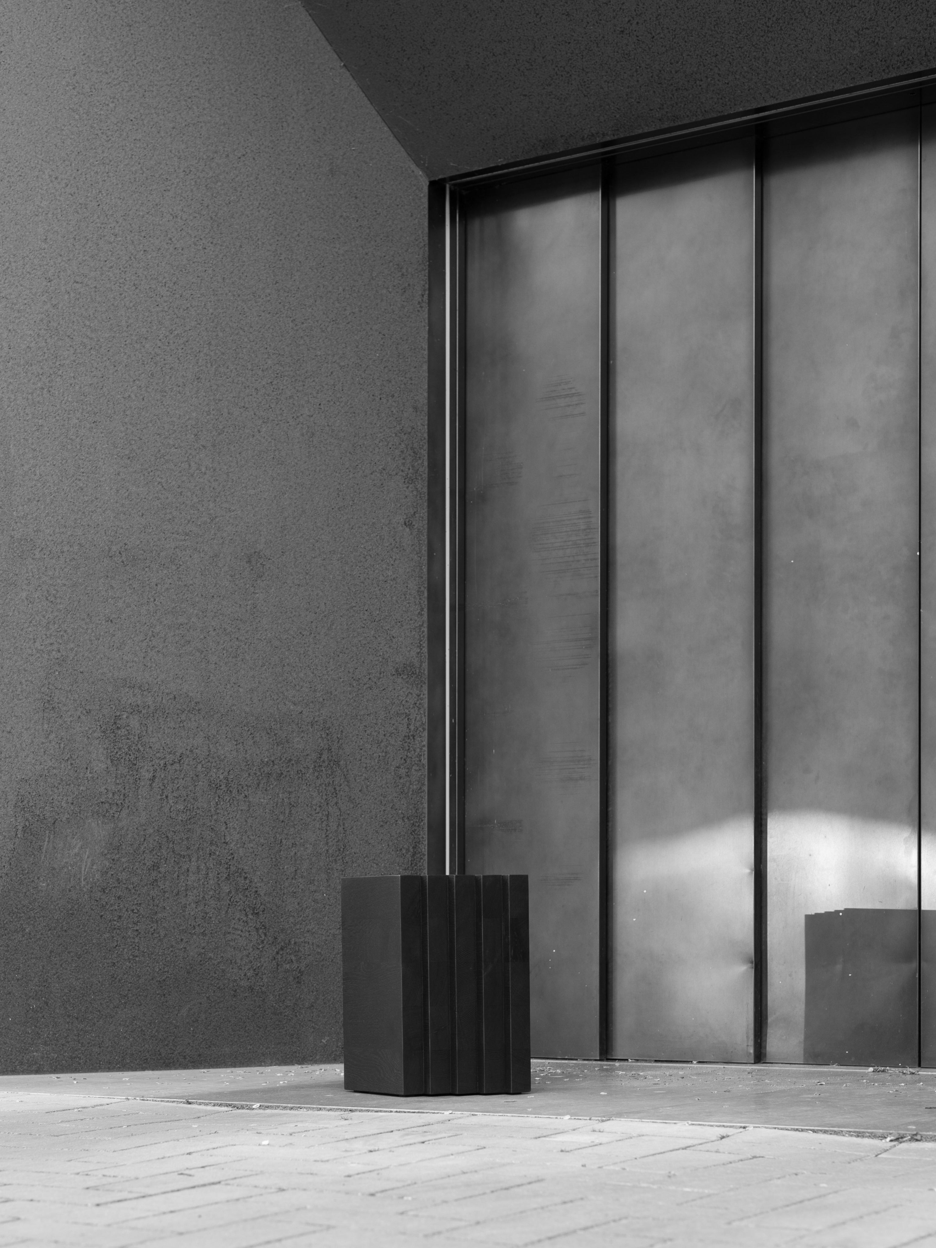 Scalae Side Table — black side table in modern outdoor setting