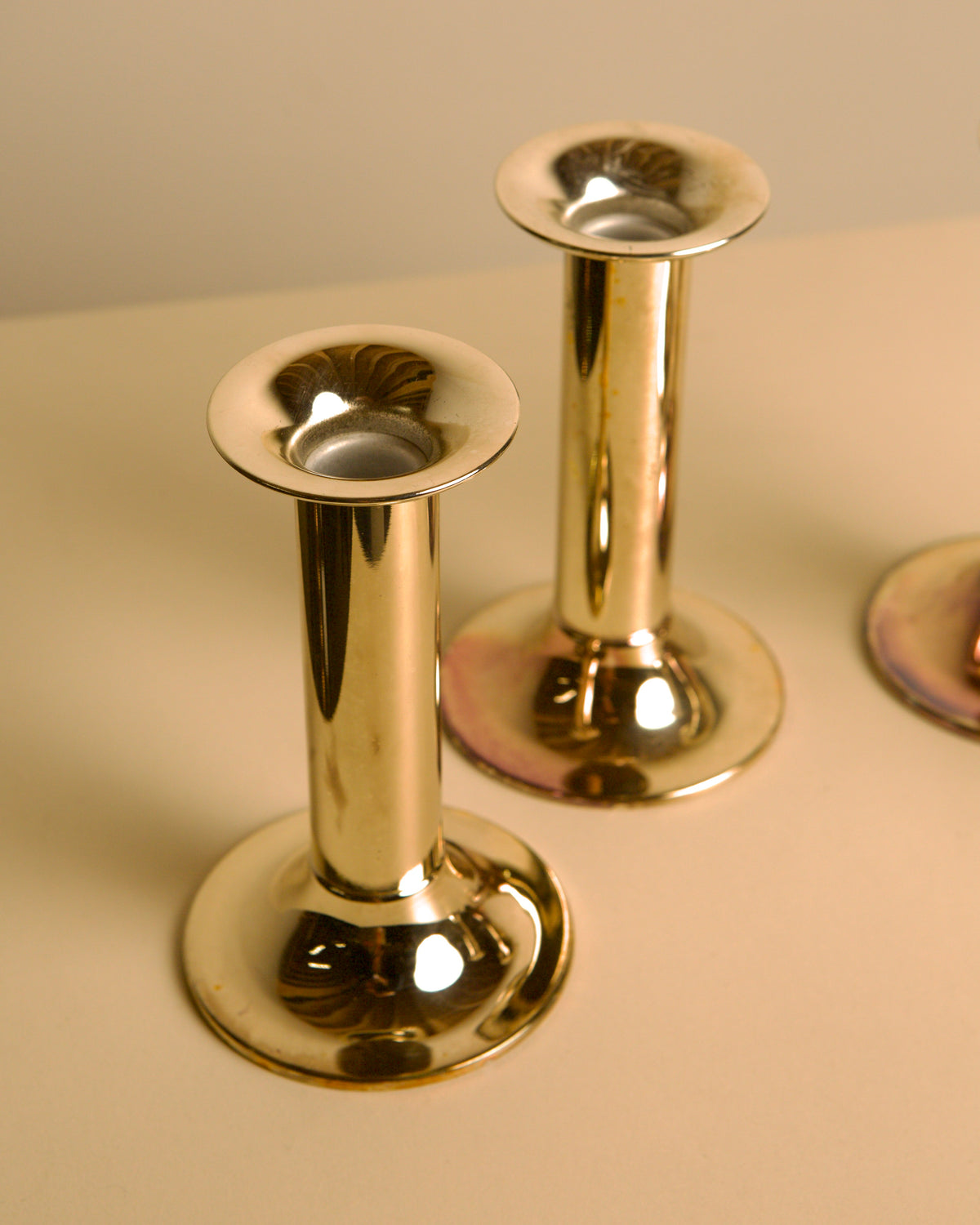 Set of 4 Italian silvered metal candle holders, 1970s — lifestyle setting