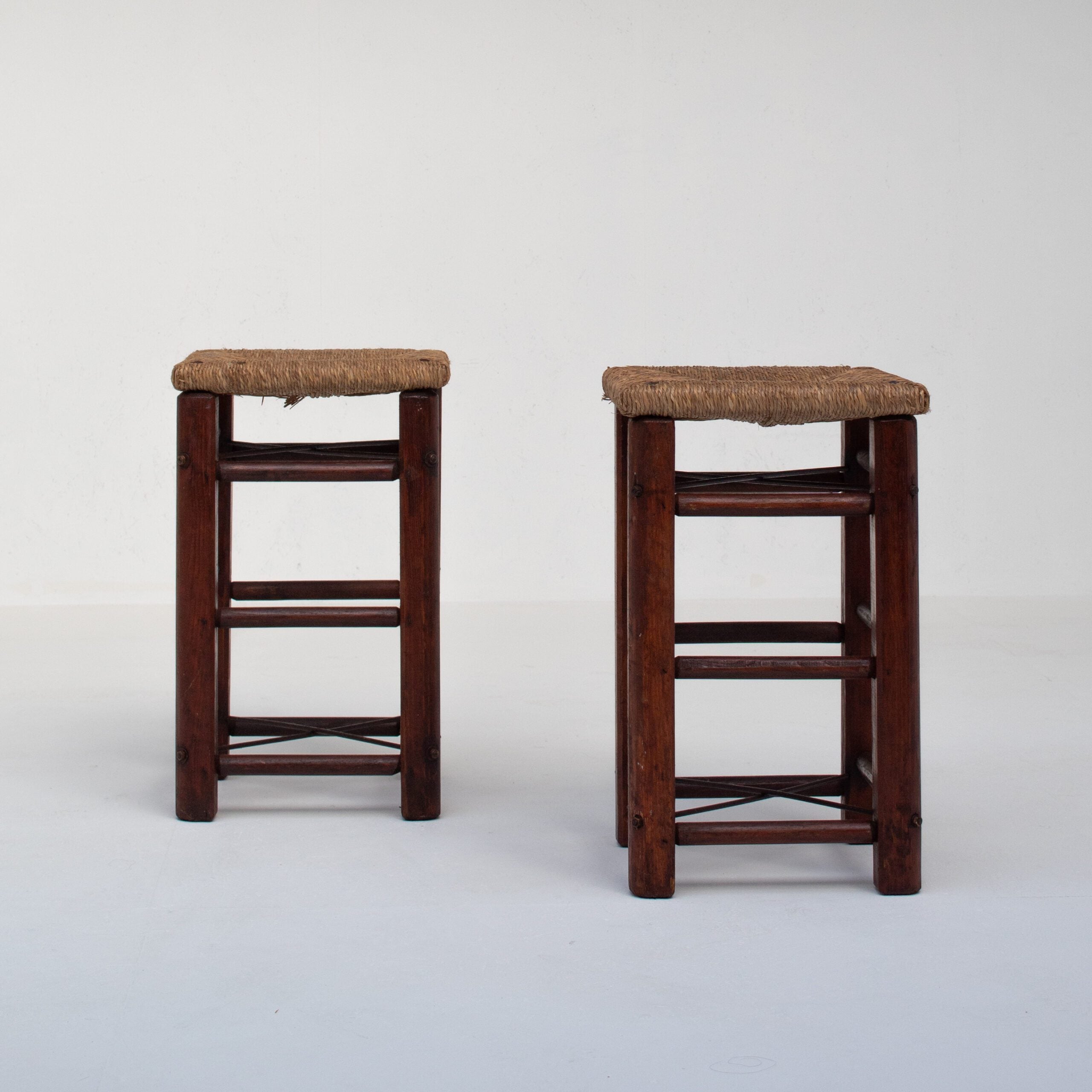 Pair of Rustic Wooden Stools with Woven Rush Seats — front view on white background